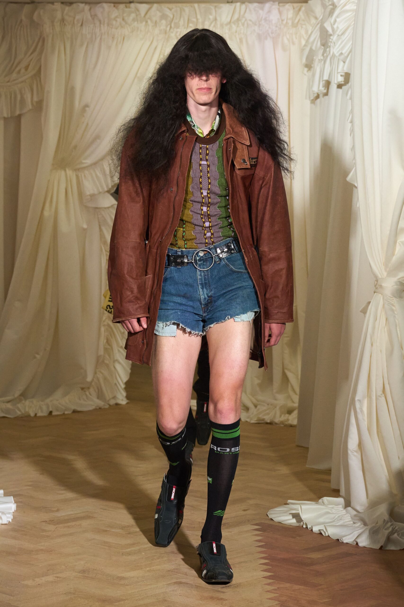 brown leather jacket with denim shorts