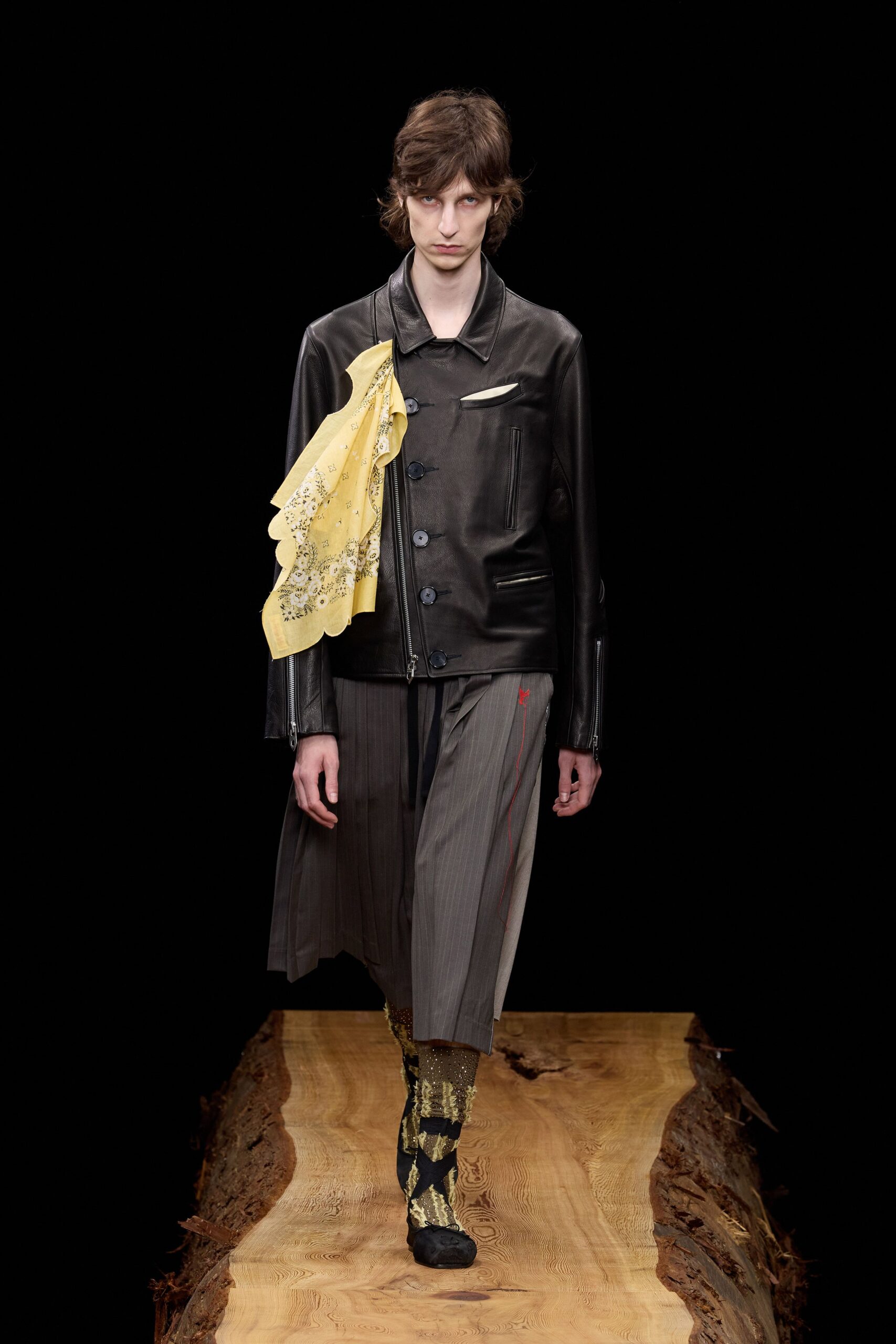 black leather coat with yellow scarf