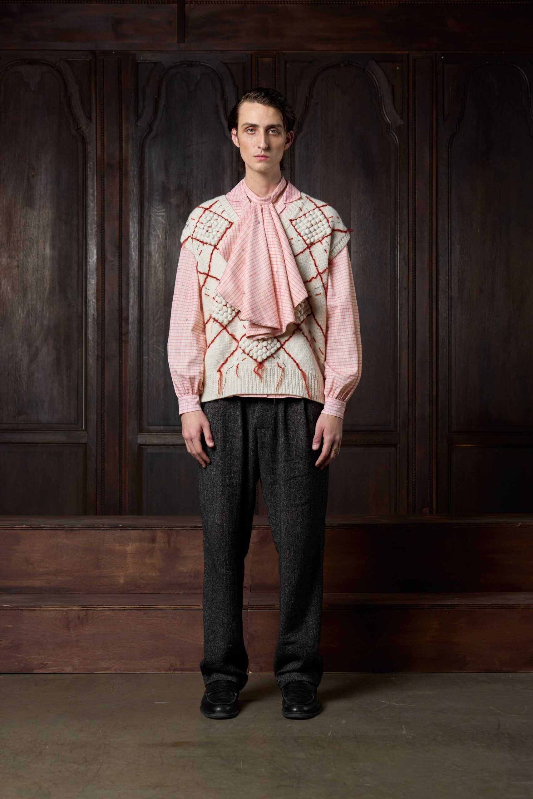 pink and white embroidered shirt with gray pants