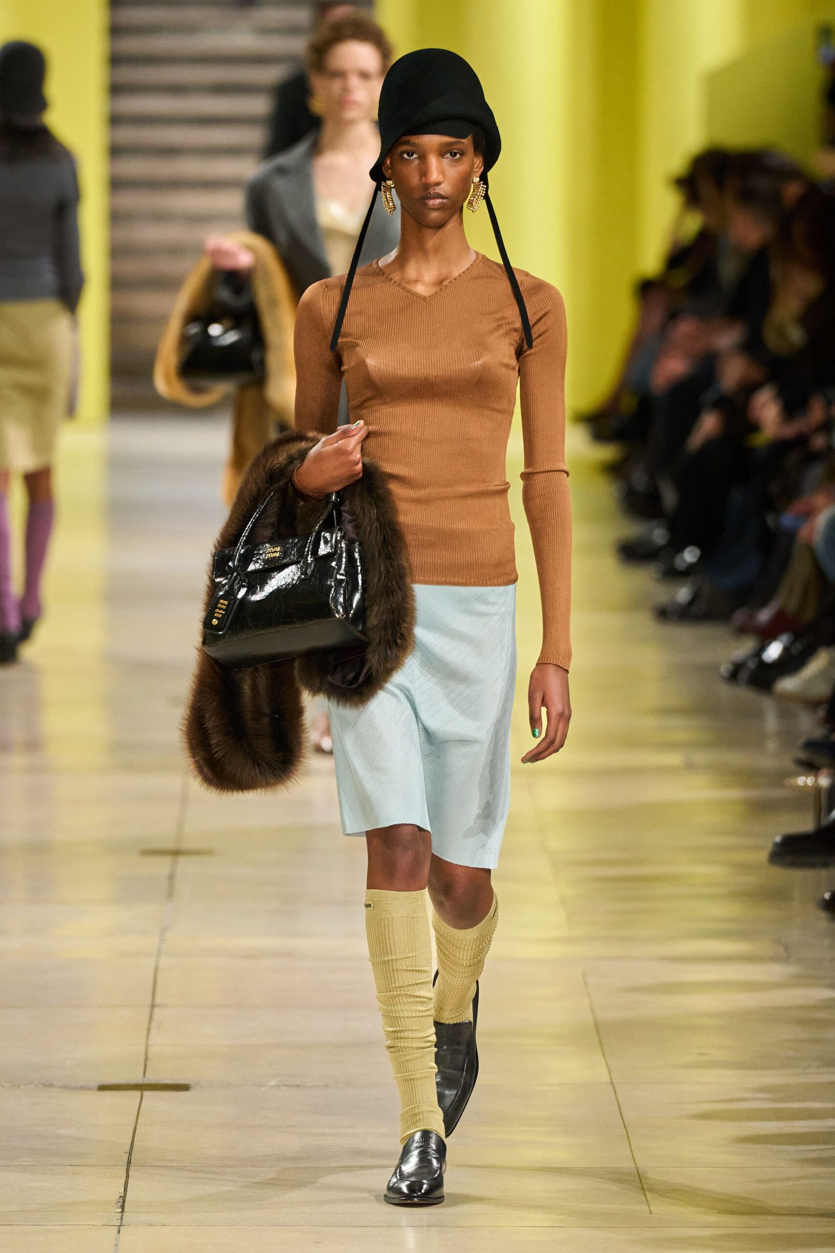 brown fitted top with blue midi skirt
