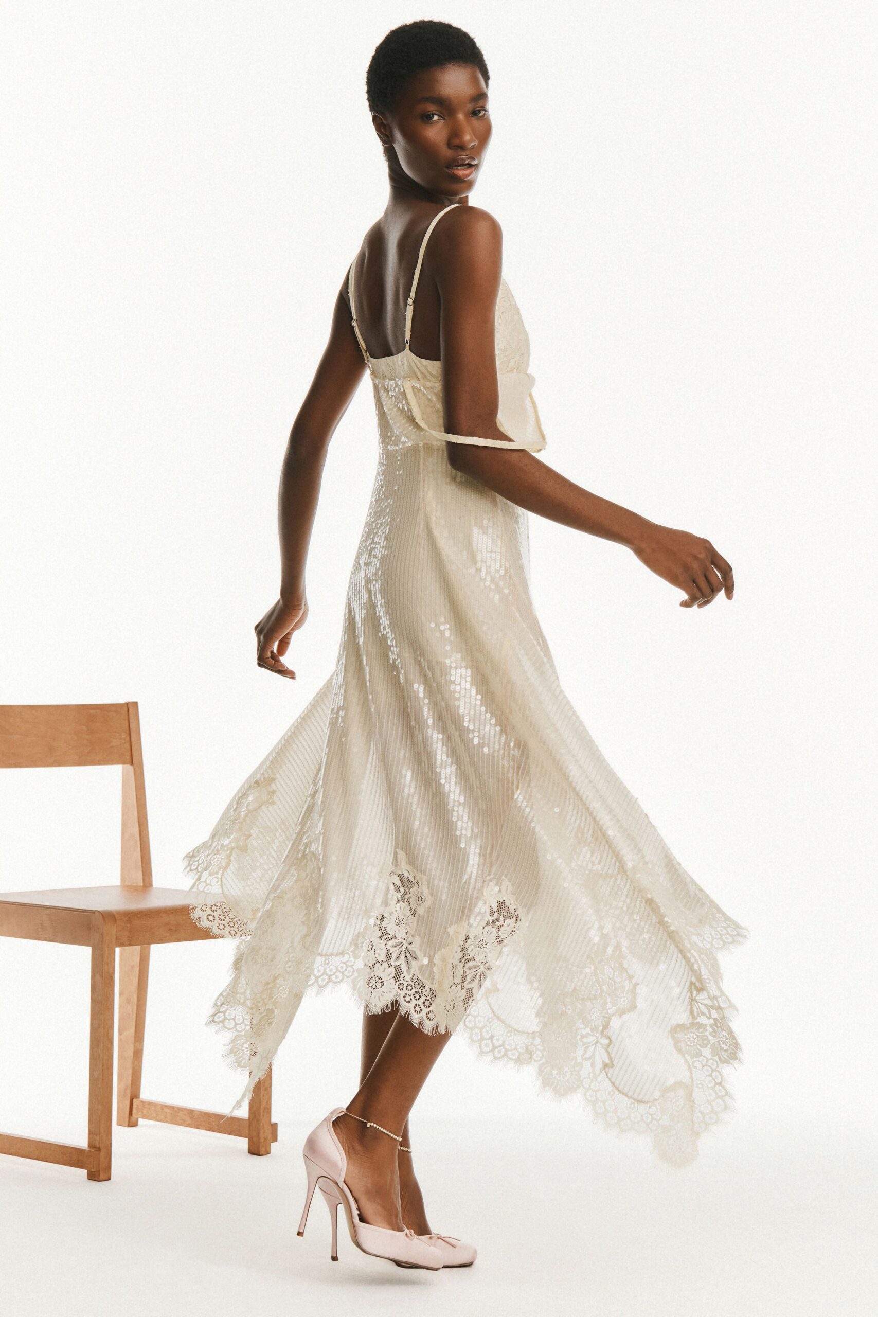 ivory silk pleated midi dress with pink shoes