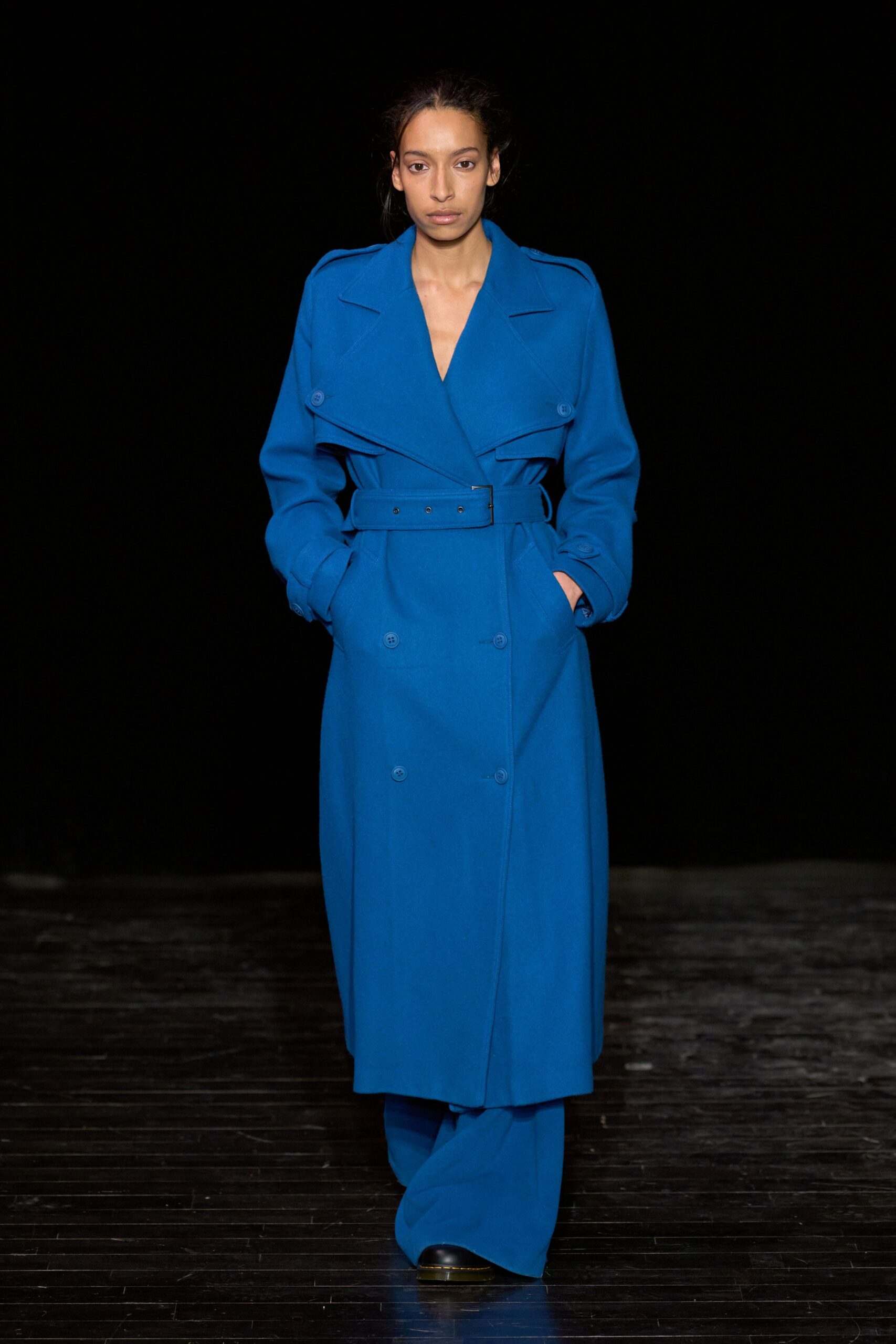 blue wool belted coat with black pants