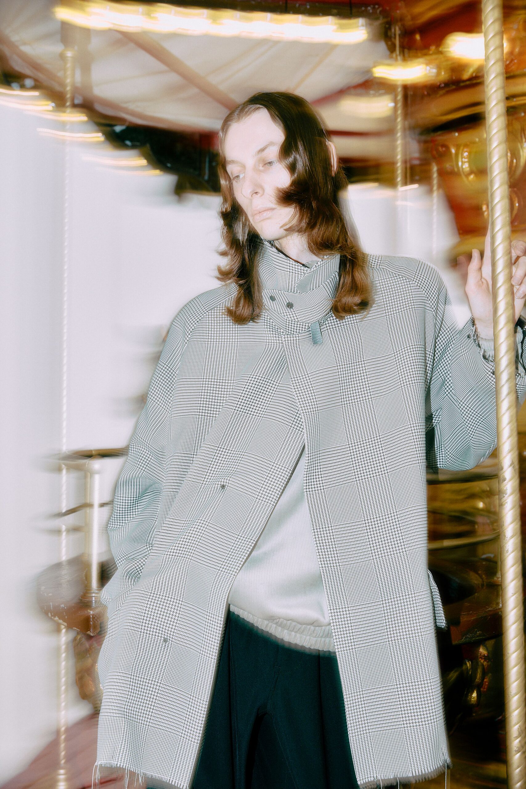 checked coat gray sweater black pants