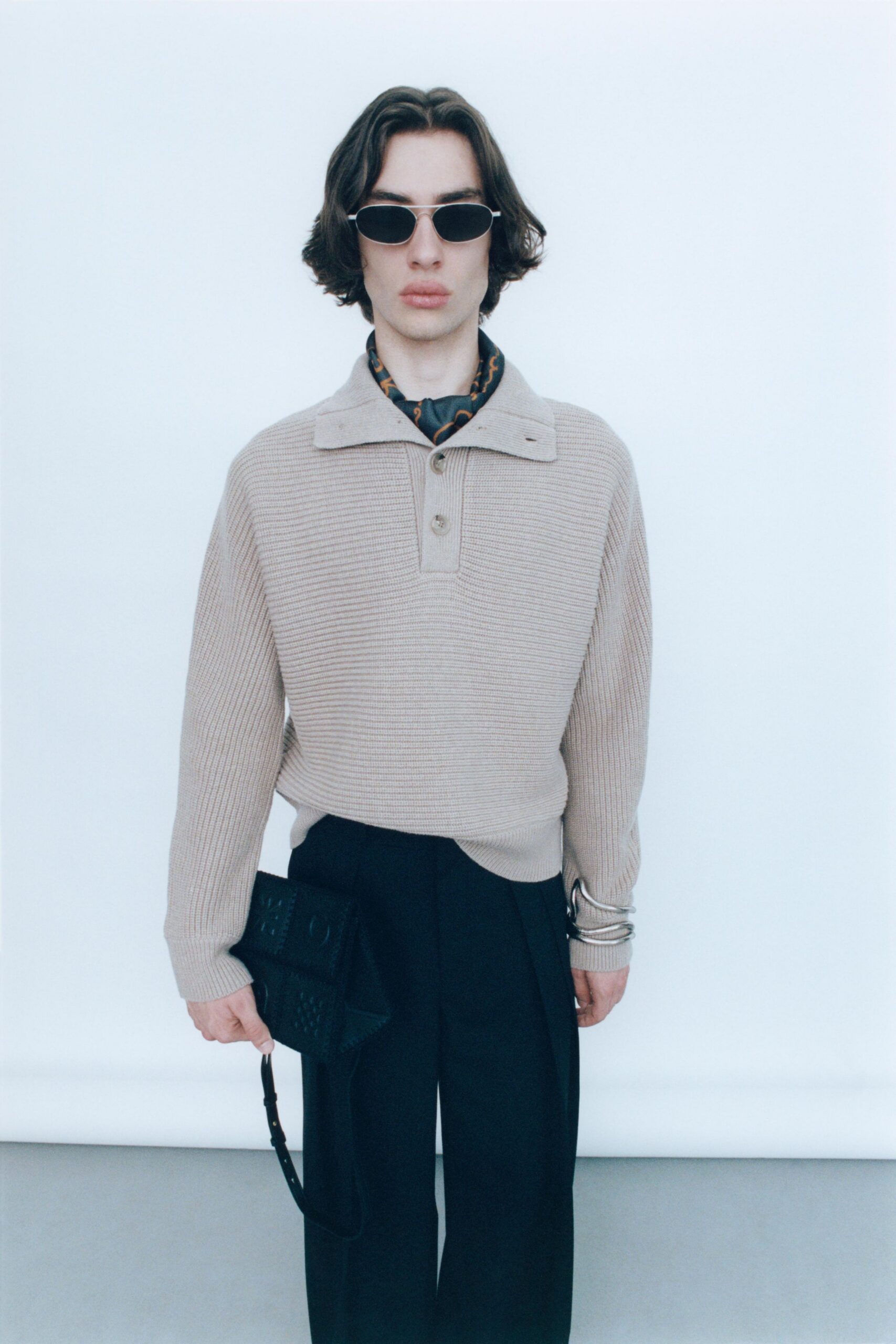 beige relaxed sweater with black pants