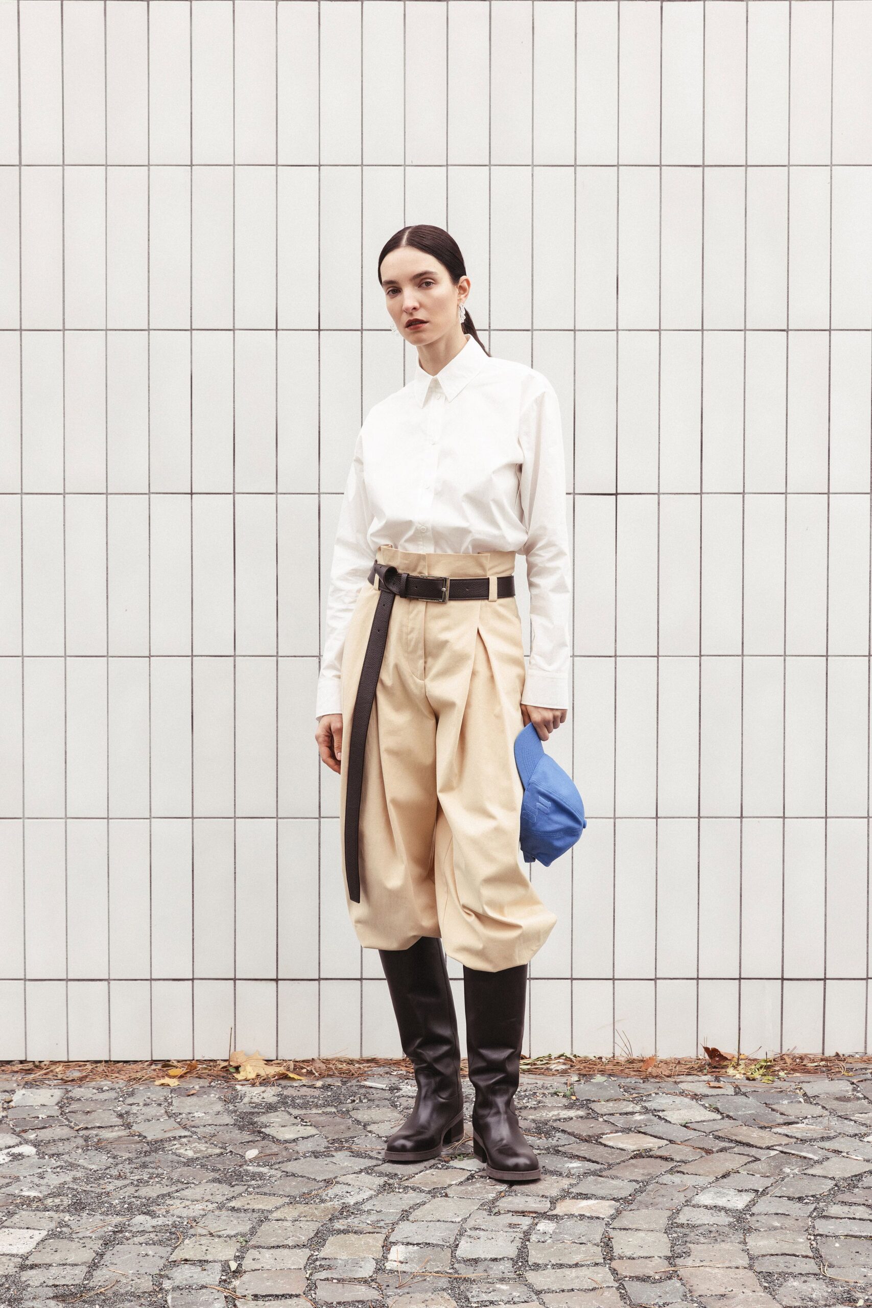 white shirt beige pants black shoes