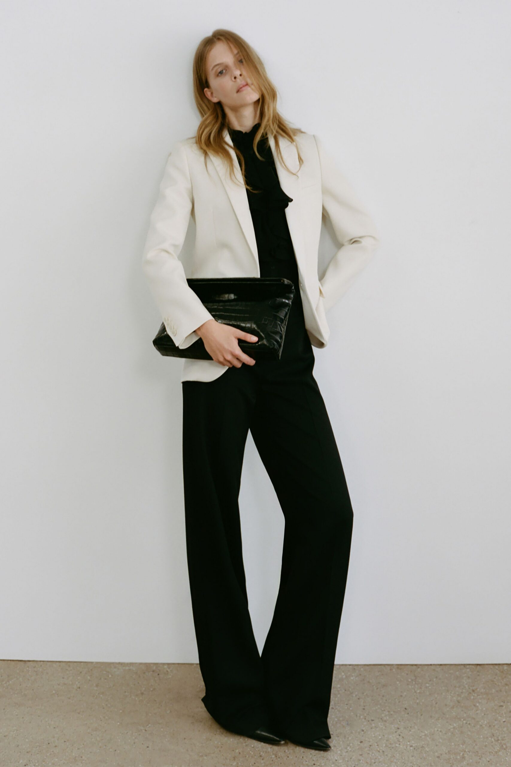 white tailored blazer black top