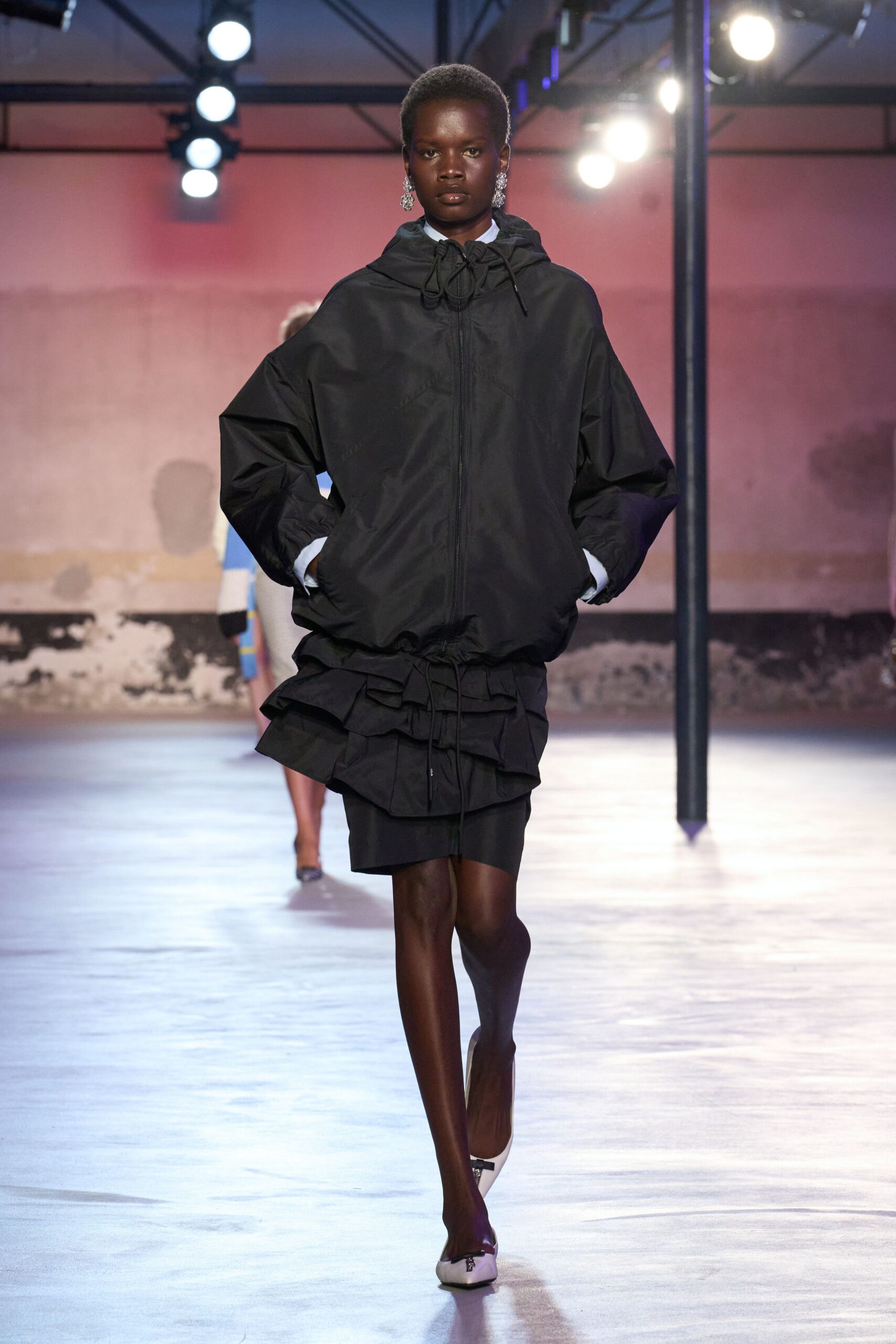 black oversized jacket with pleated skirt