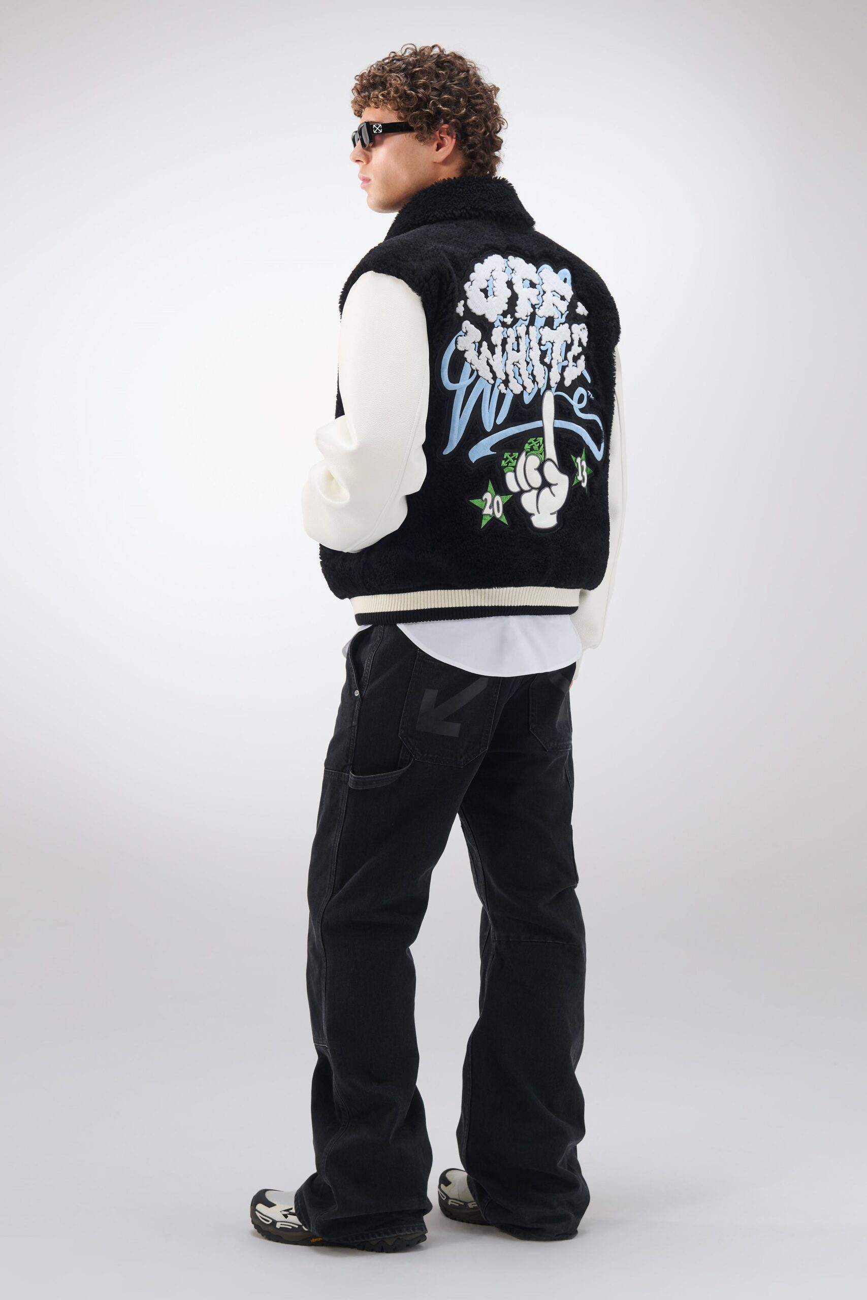 black faux-fur vest with white shirt