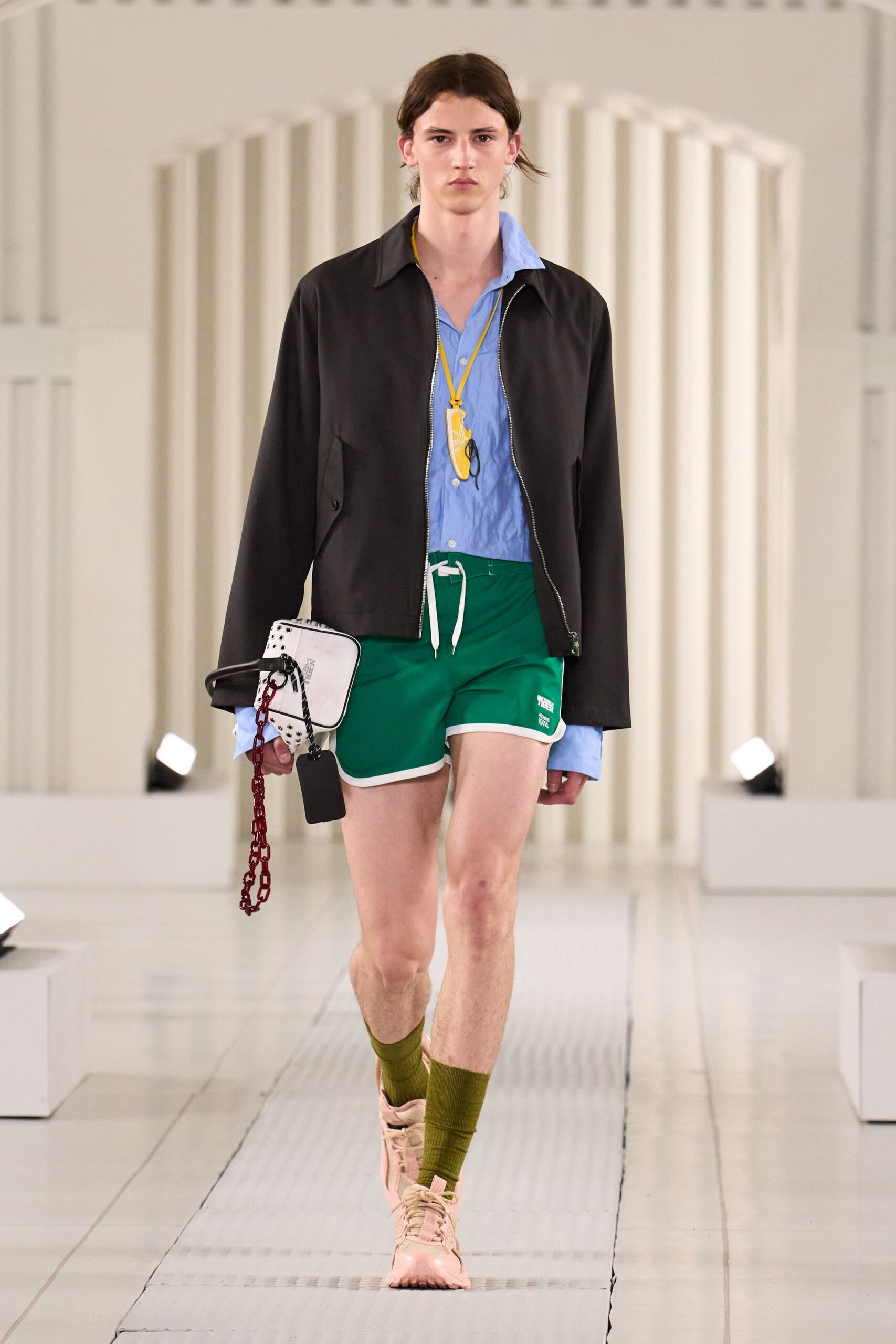 black jacket blue shirt green shorts