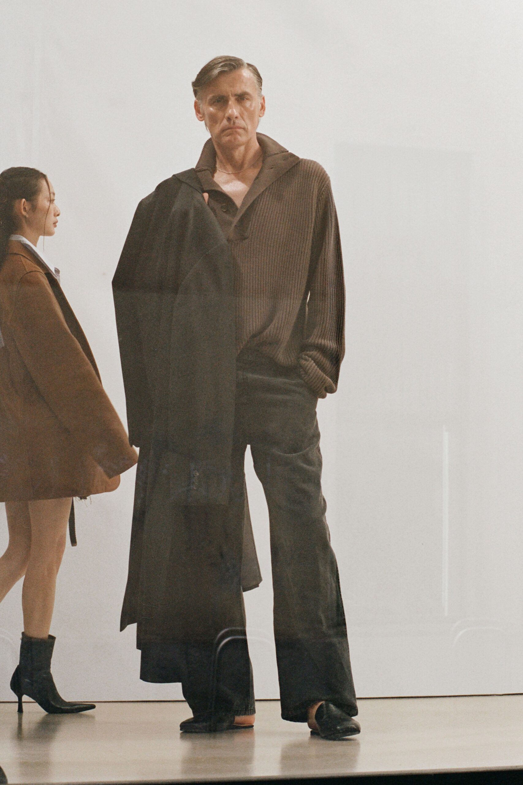 black coat brown top tailored pants