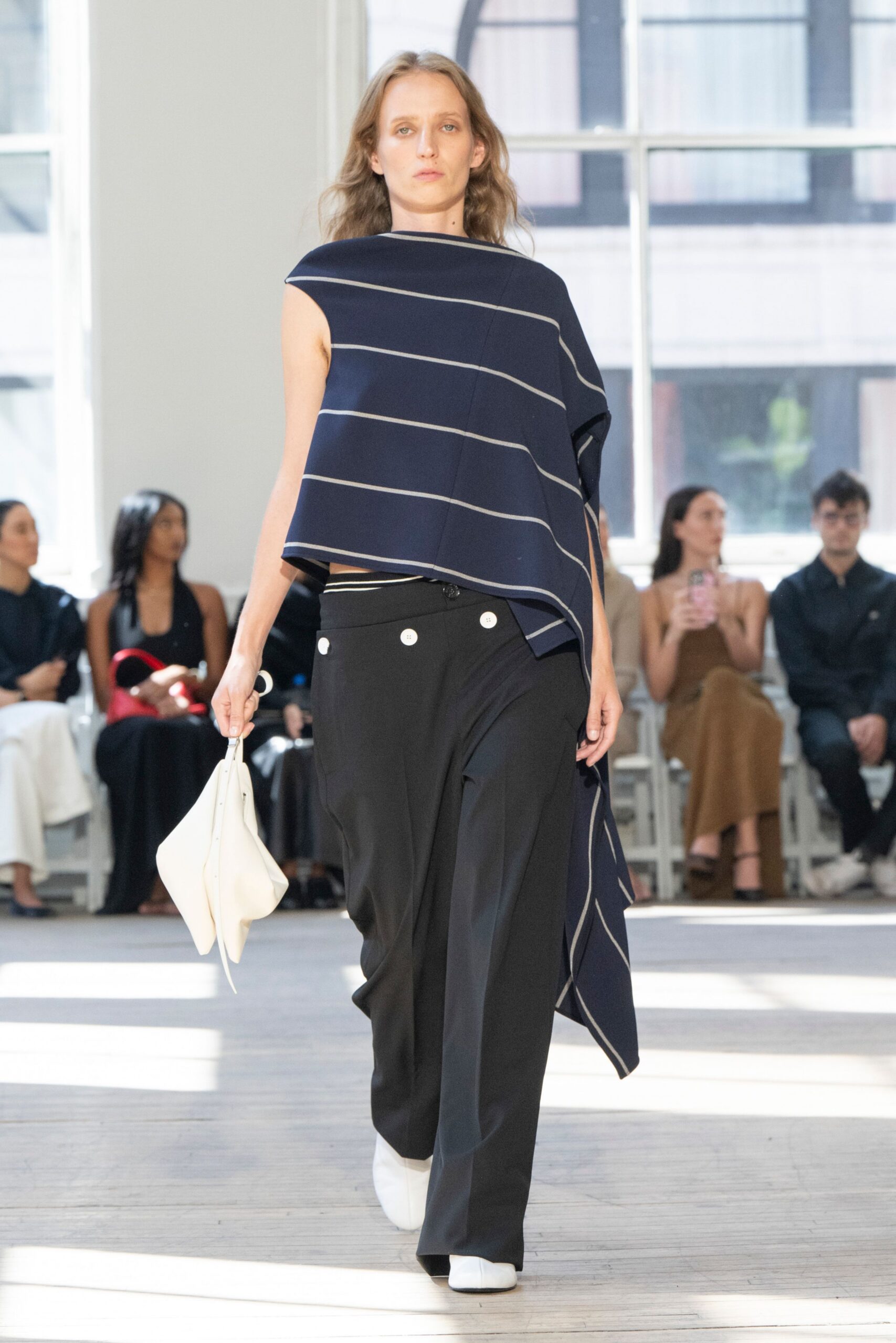 navy striped sleeveless top with black pants