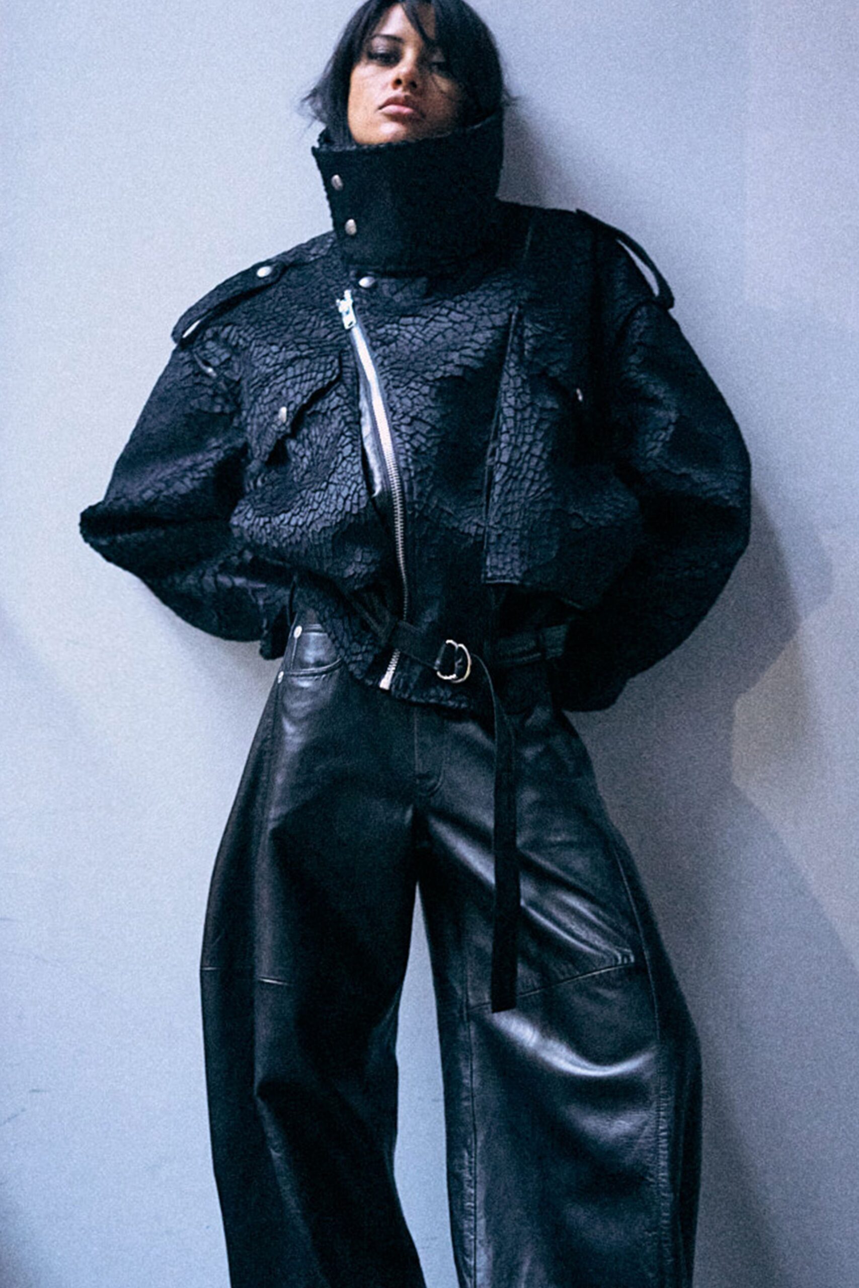 black leather long-sleeve collared oversized zippered pockets jacket