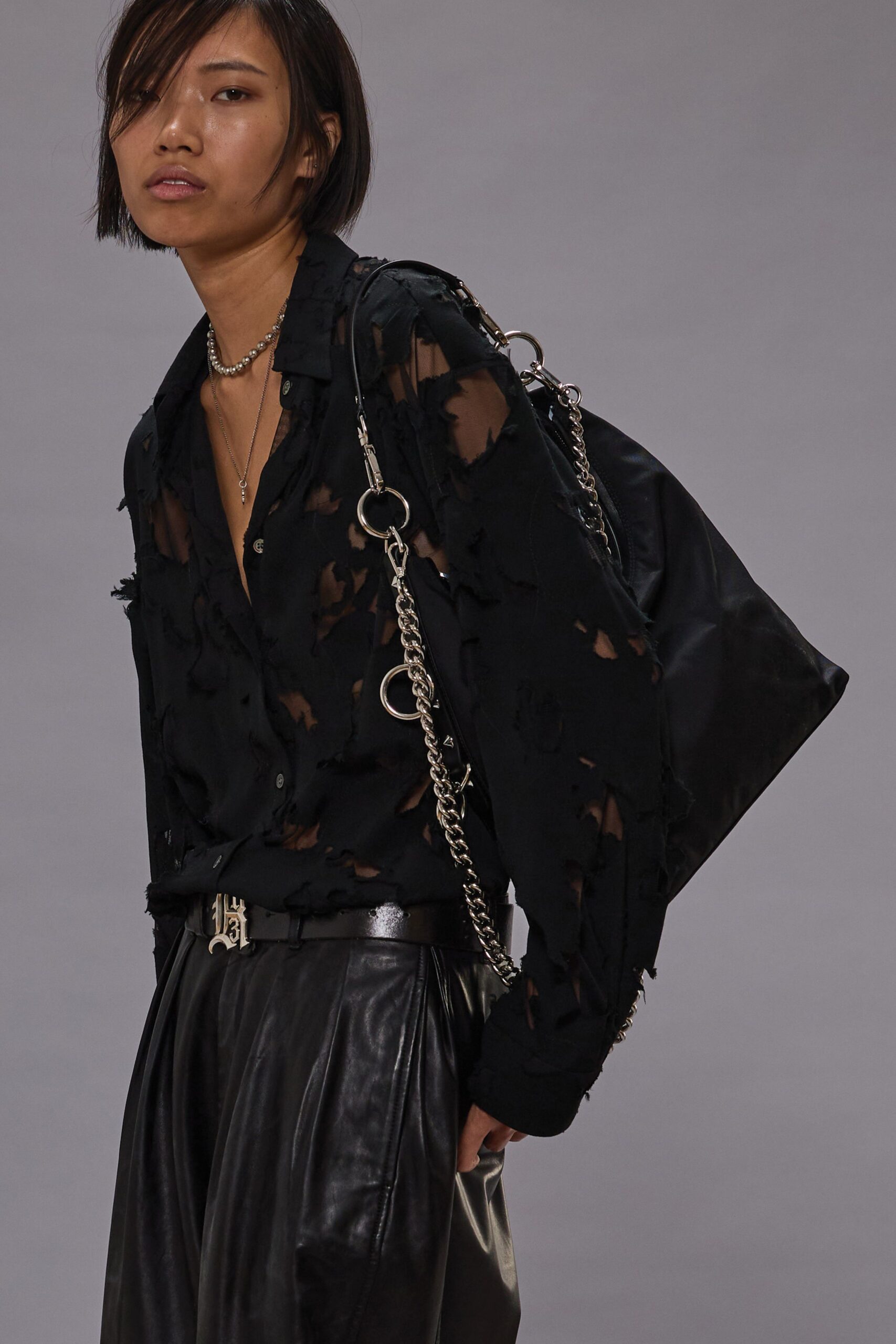 black distressed shirt and leather pants