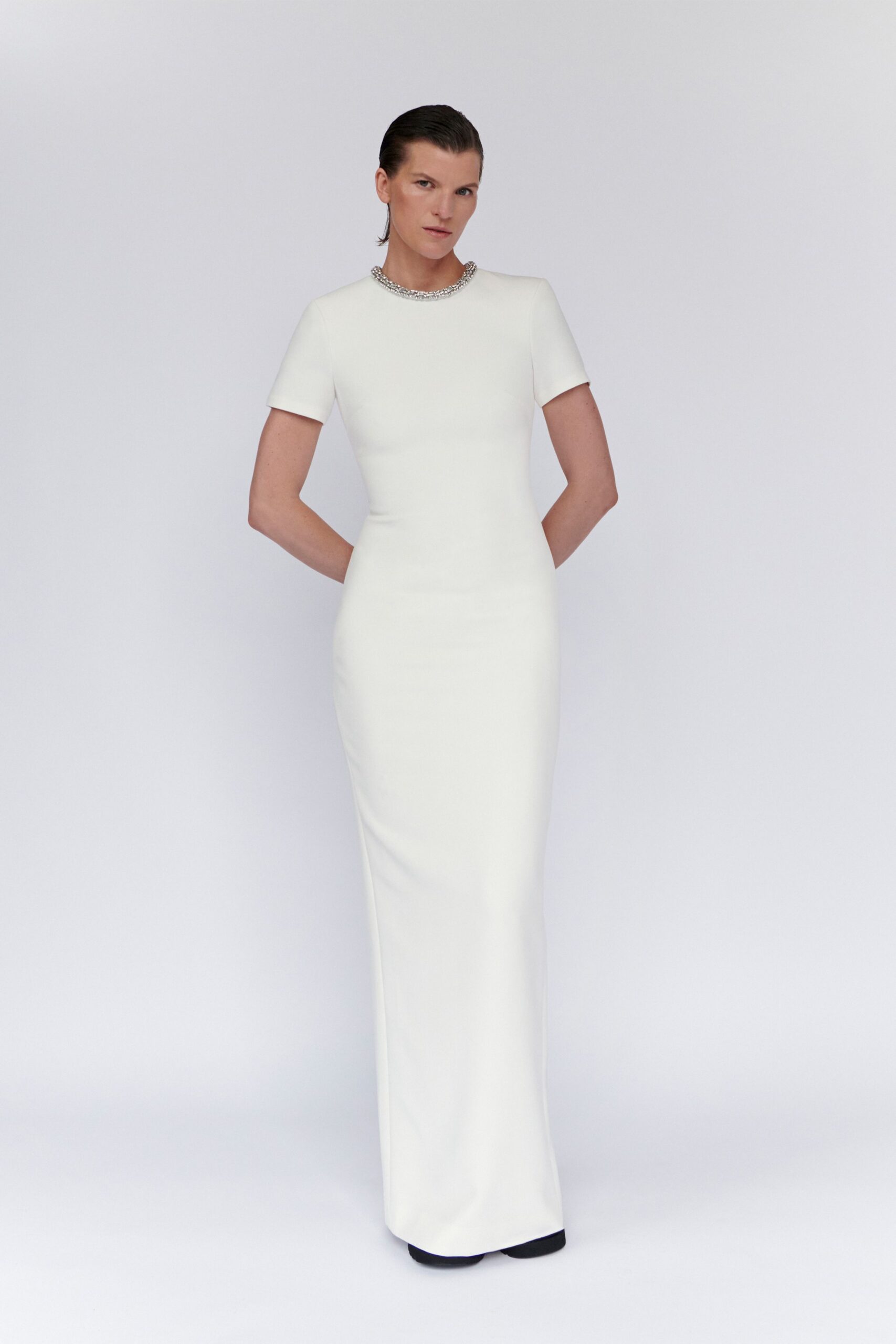 white fitted gown with embellishments