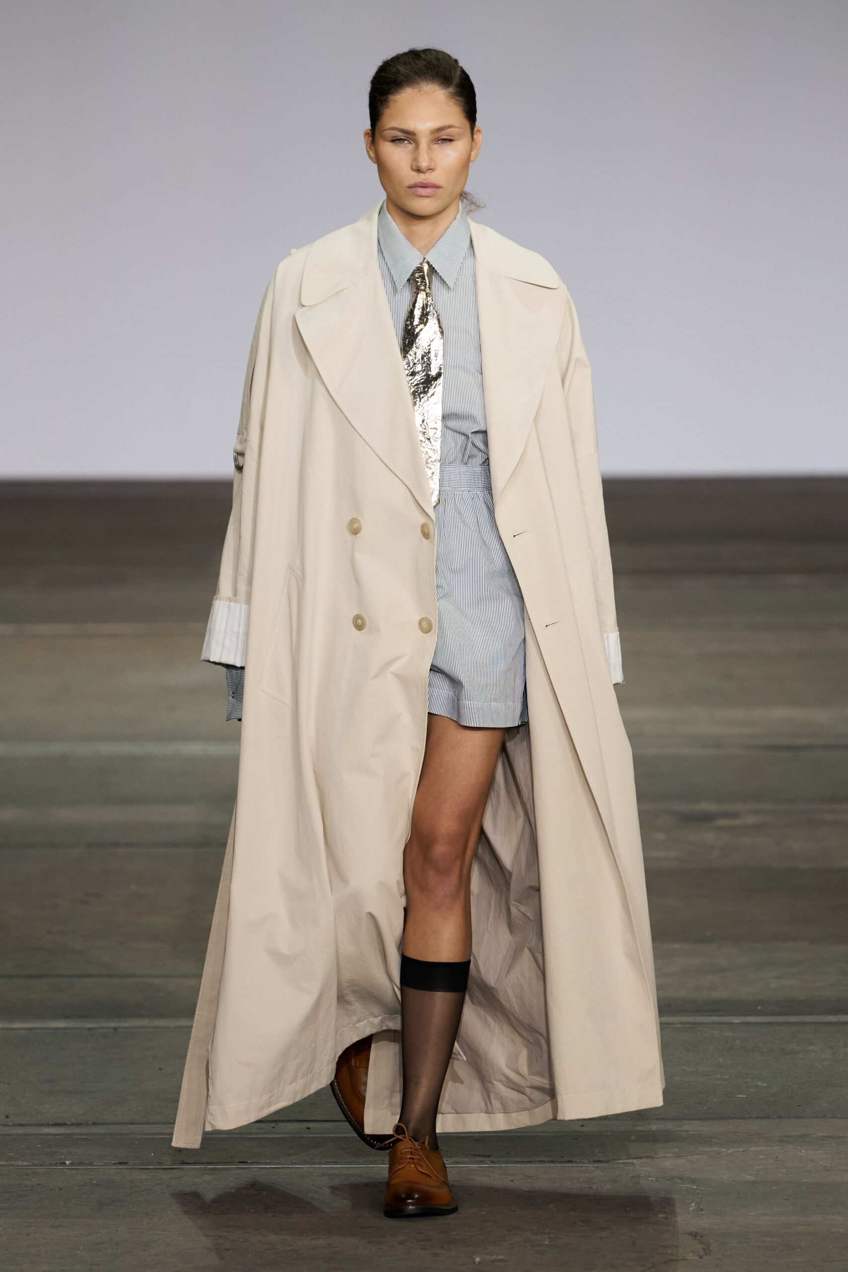 beige trench coat with blue shirt