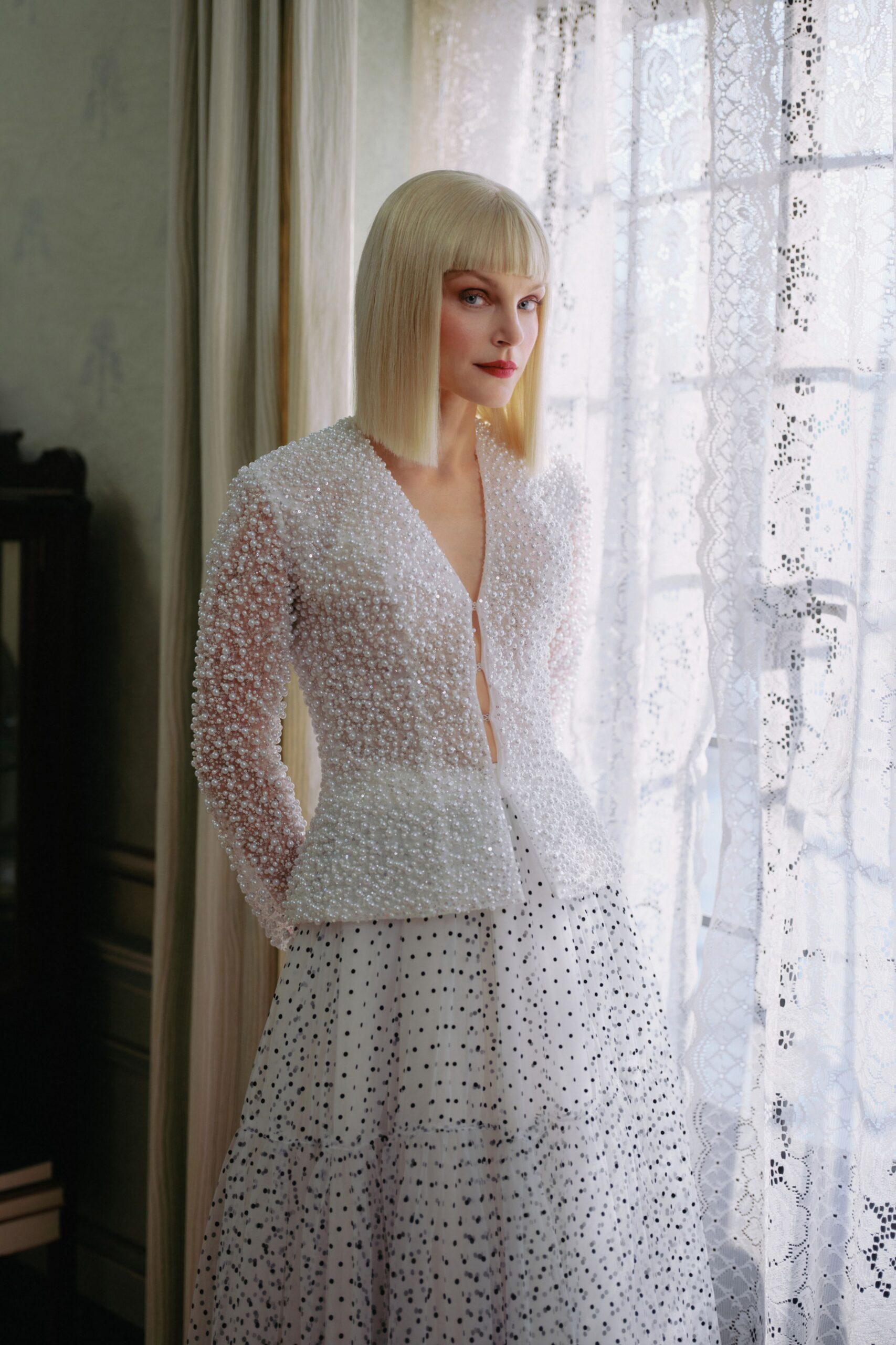 white embroidered blouse and polka-dot skirt