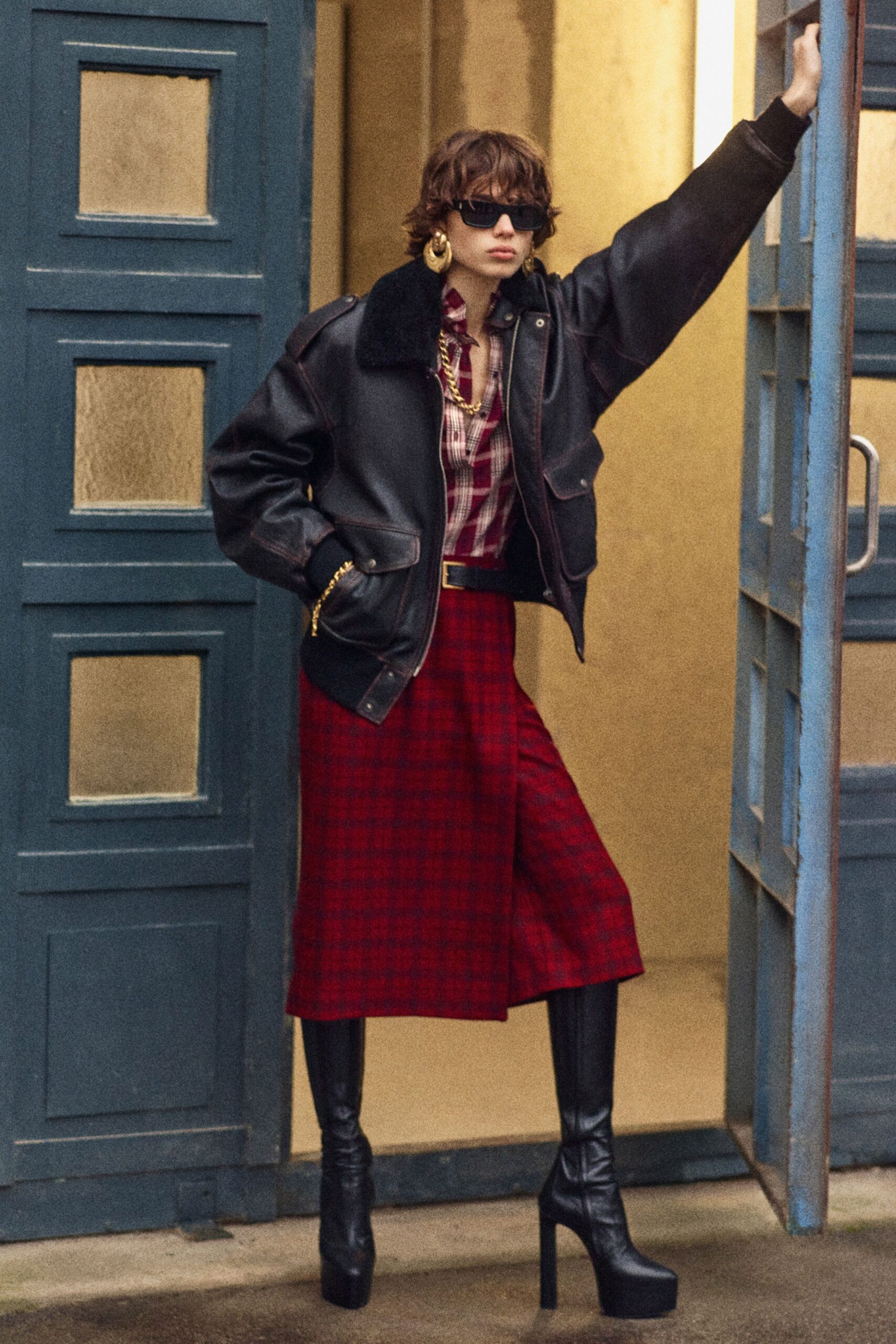 black leather jacket with red skirt