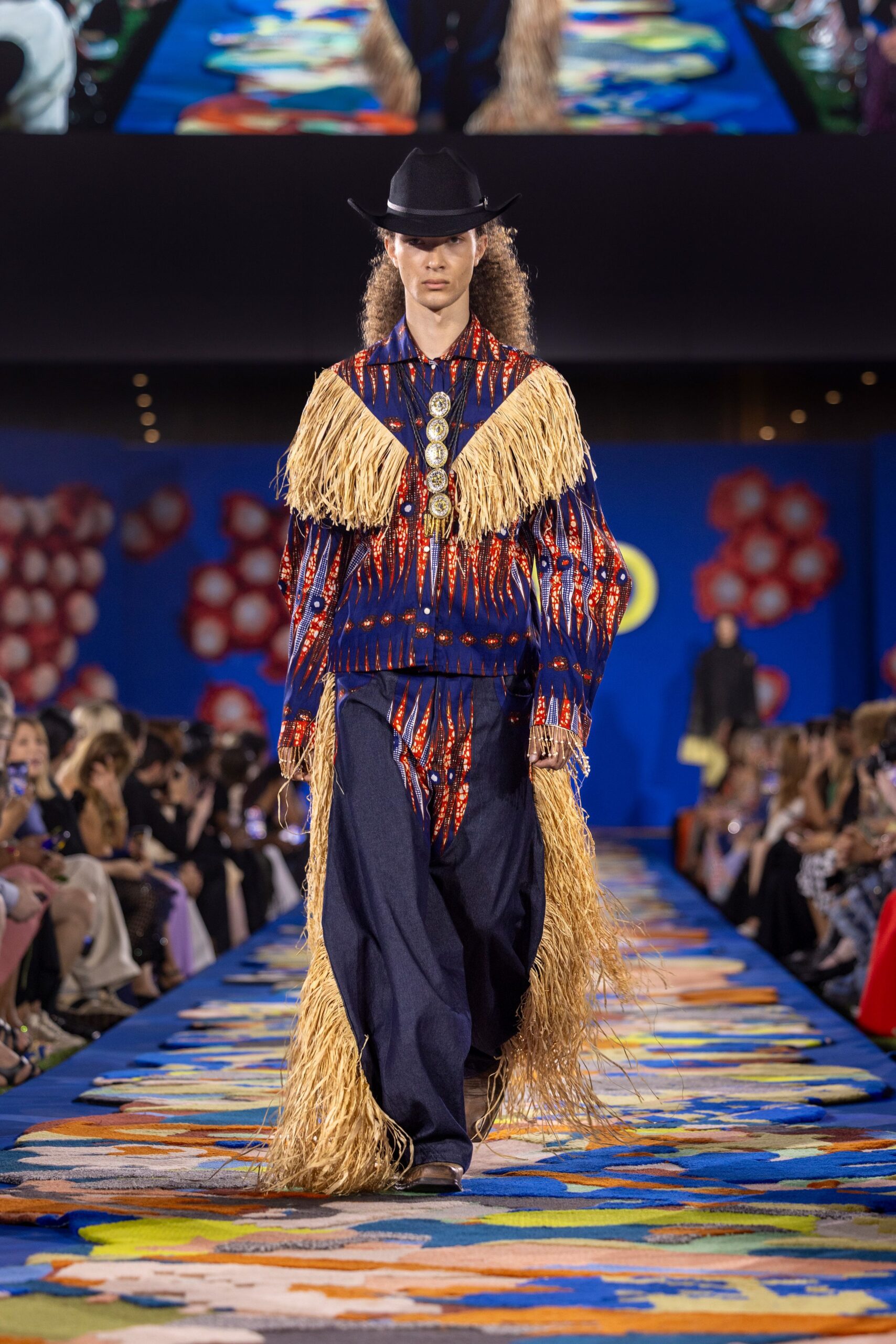 fringed blue top with wide-leg pants