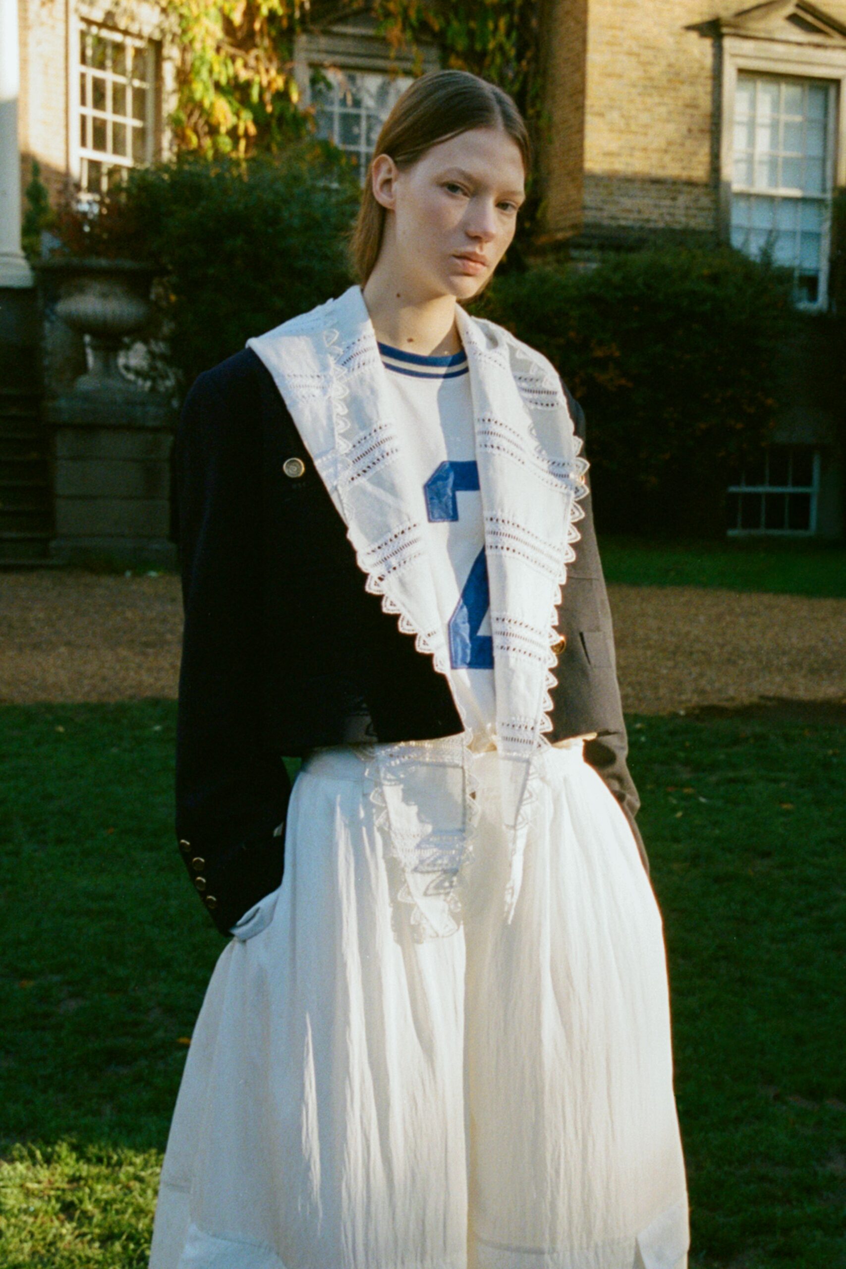 black jacket white shirt pleated skirt