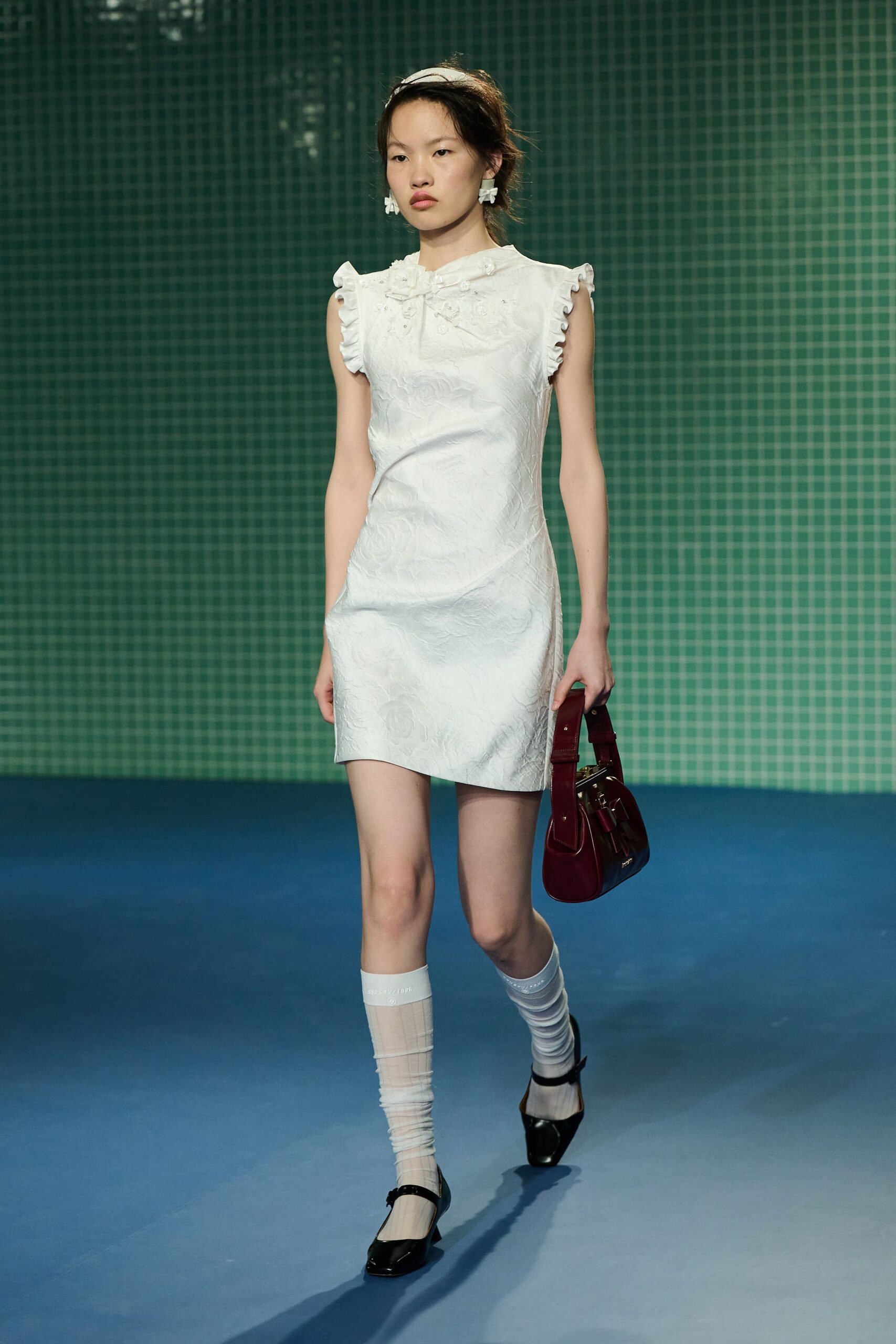 white fitted mini-dress with ruffles