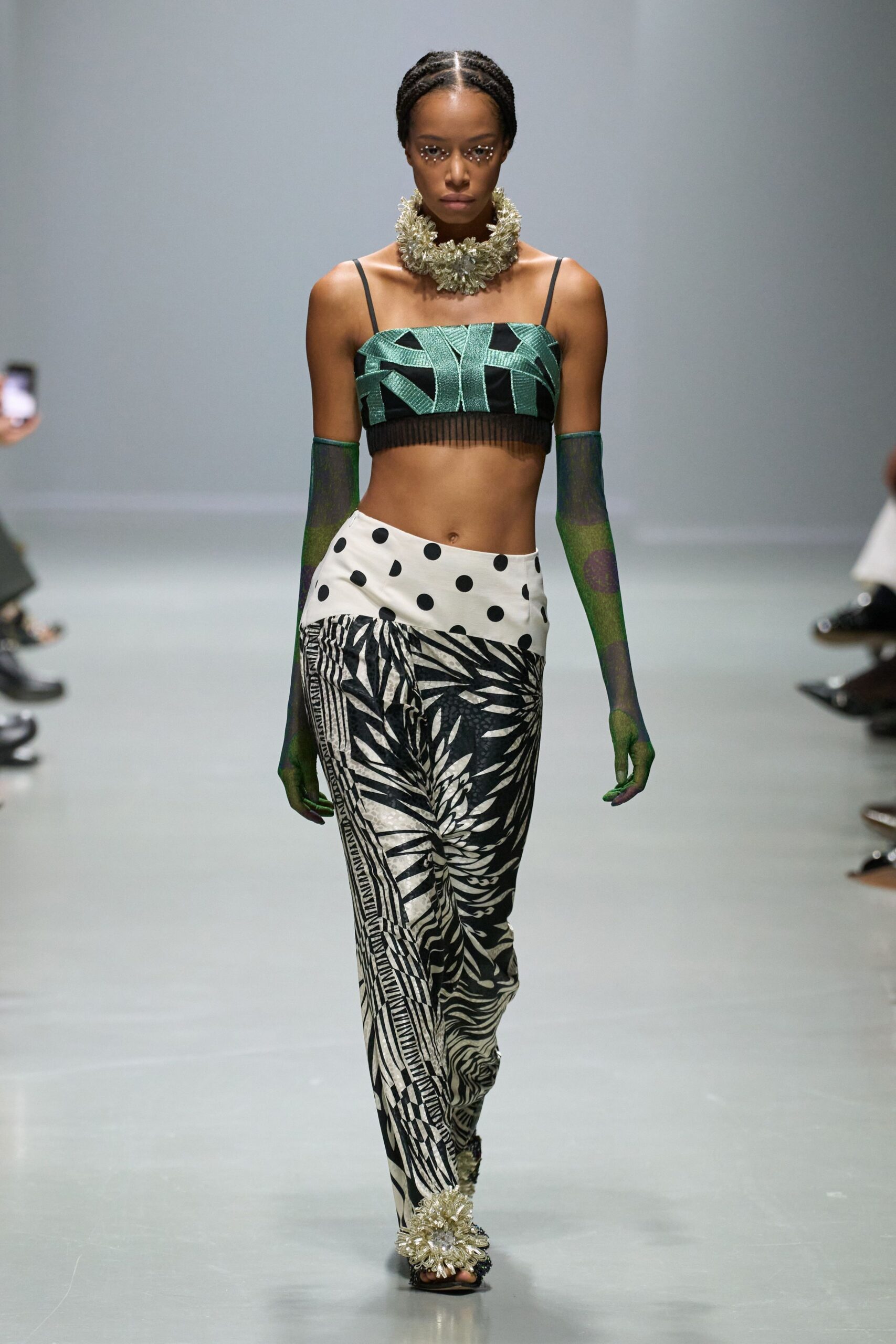 green sleeveless fitted printed top
