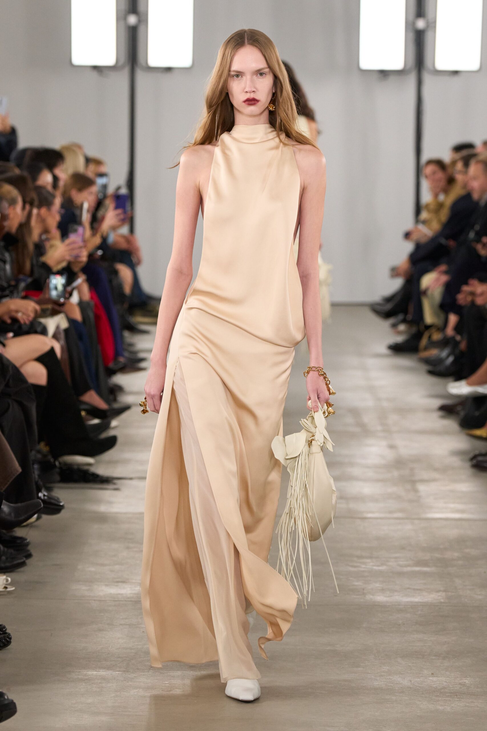 beige silk sleeveless high-neck fitted flowing maxi gown