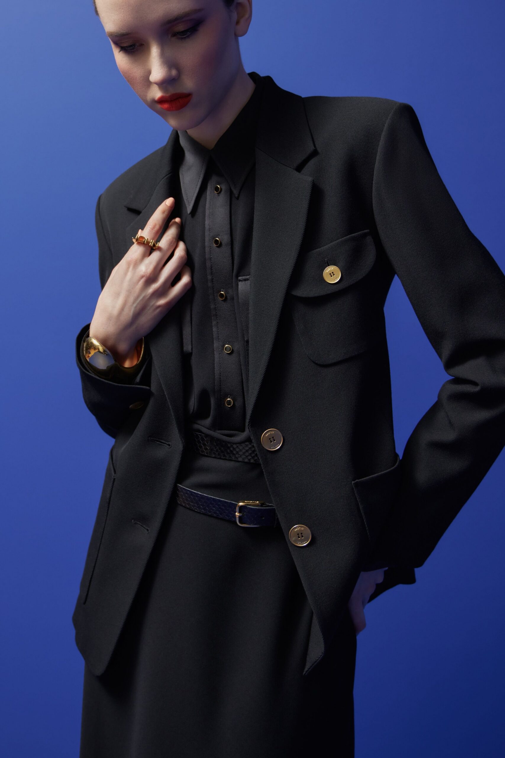 black structured blazer with shirt and skirt