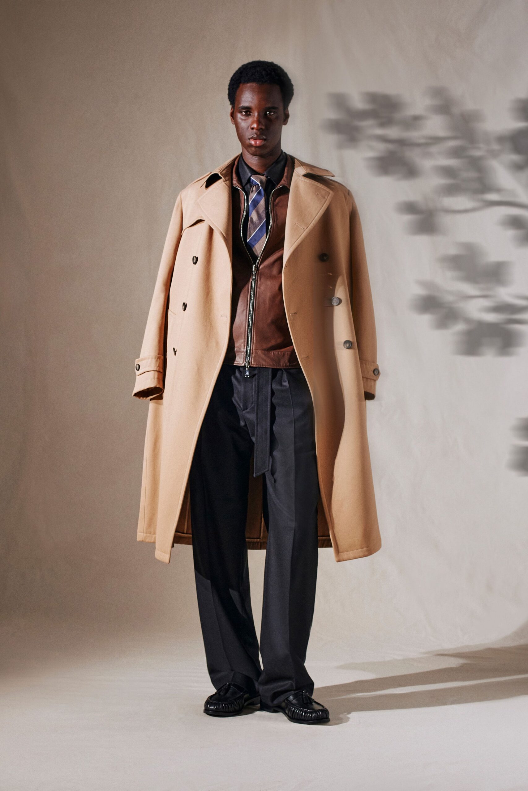 beige wool coat with brown leather jacket