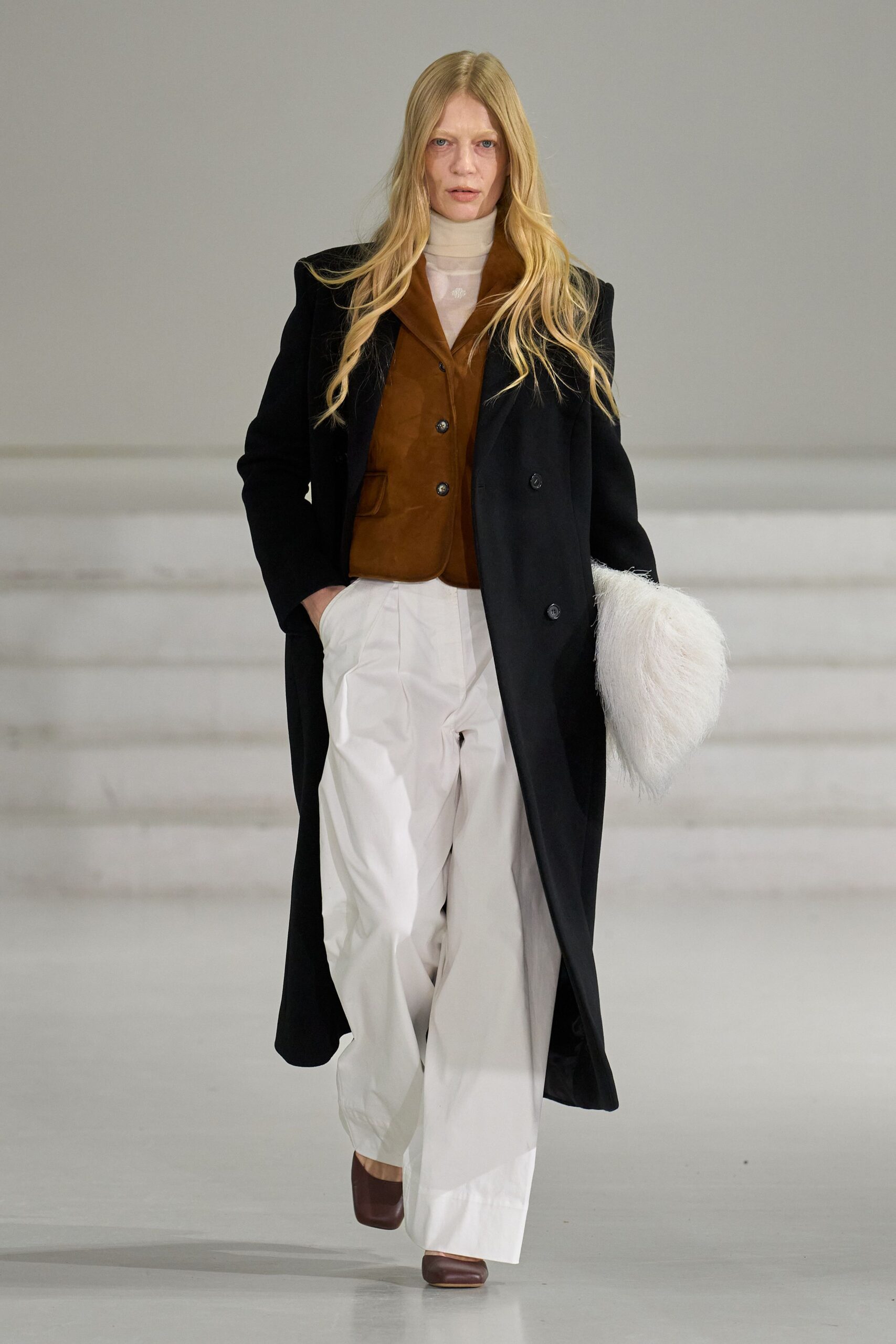 black coat brown blazer white pants