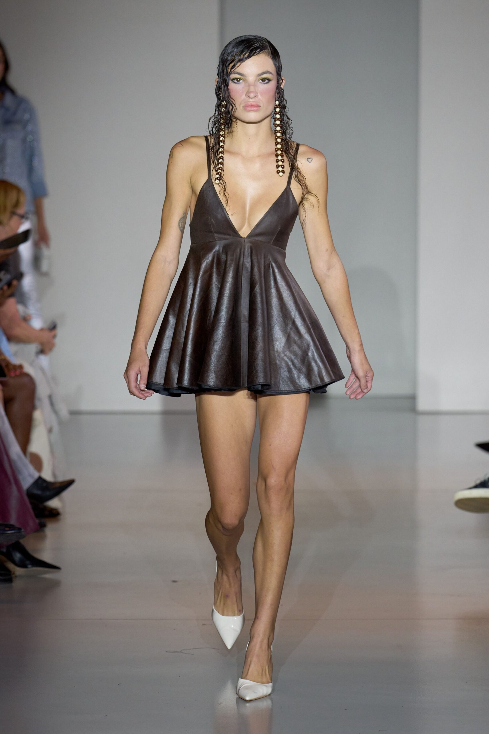 brown leather mini dress with white shoes