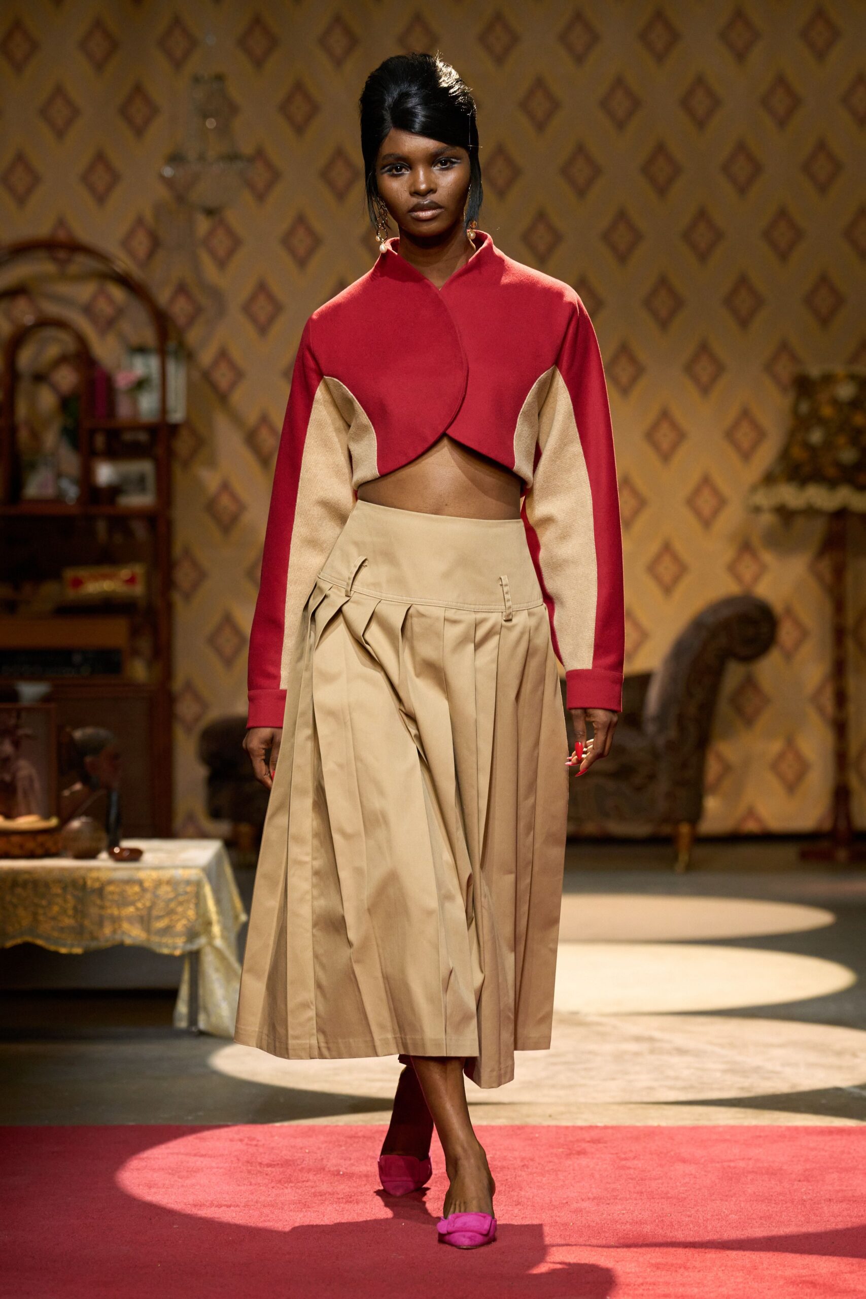 red beige asymmetric top with pleated skirt
