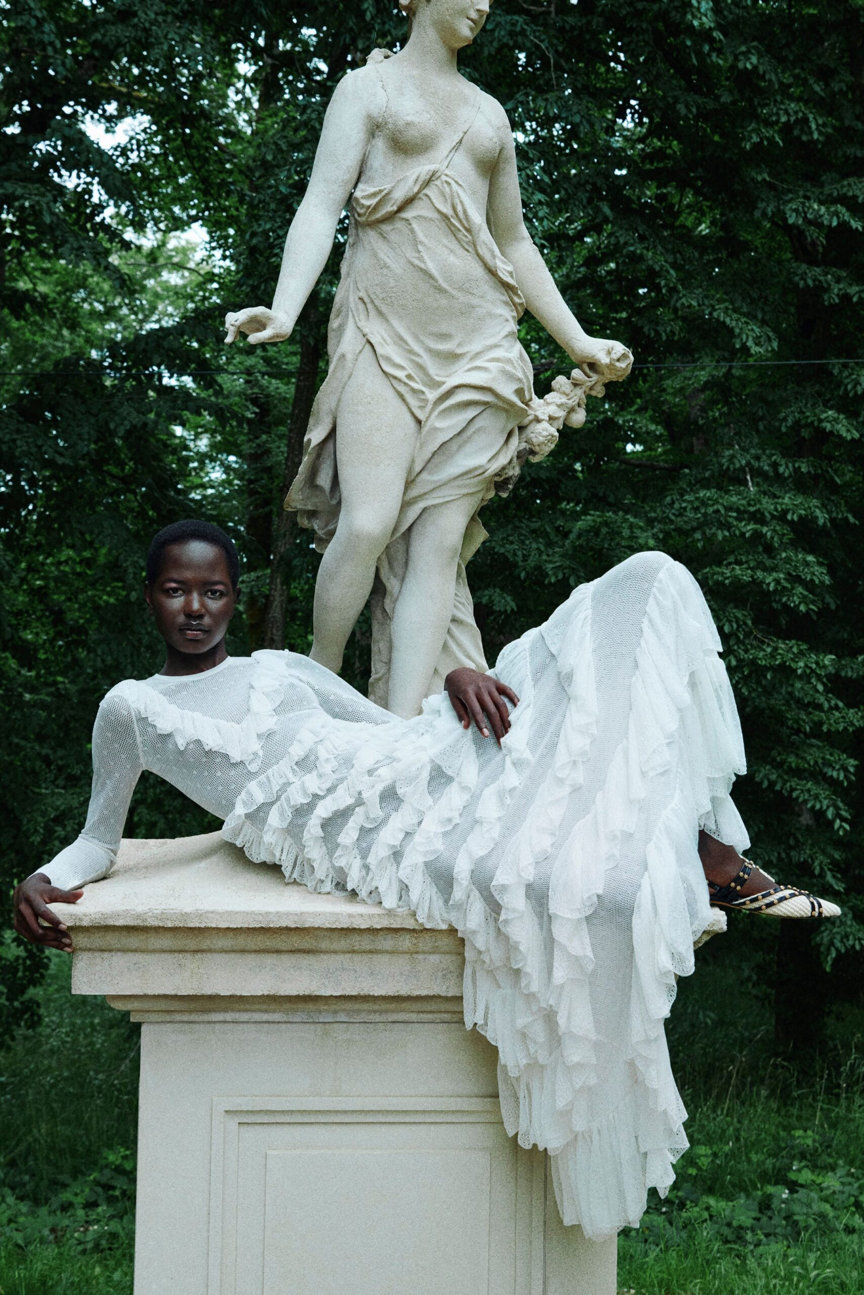 white ruffled maxi gown with shoes