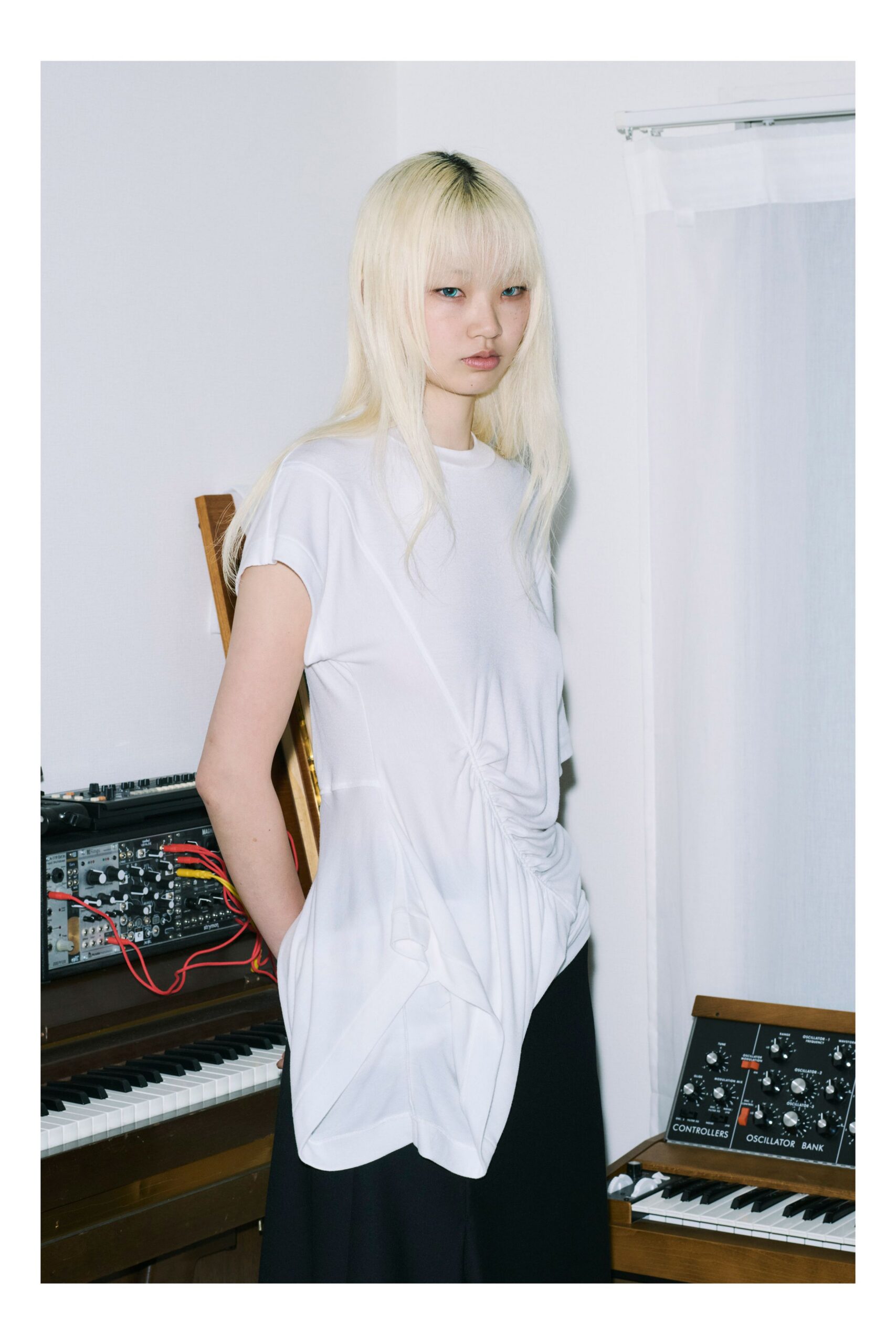 white relaxed top with black skirt