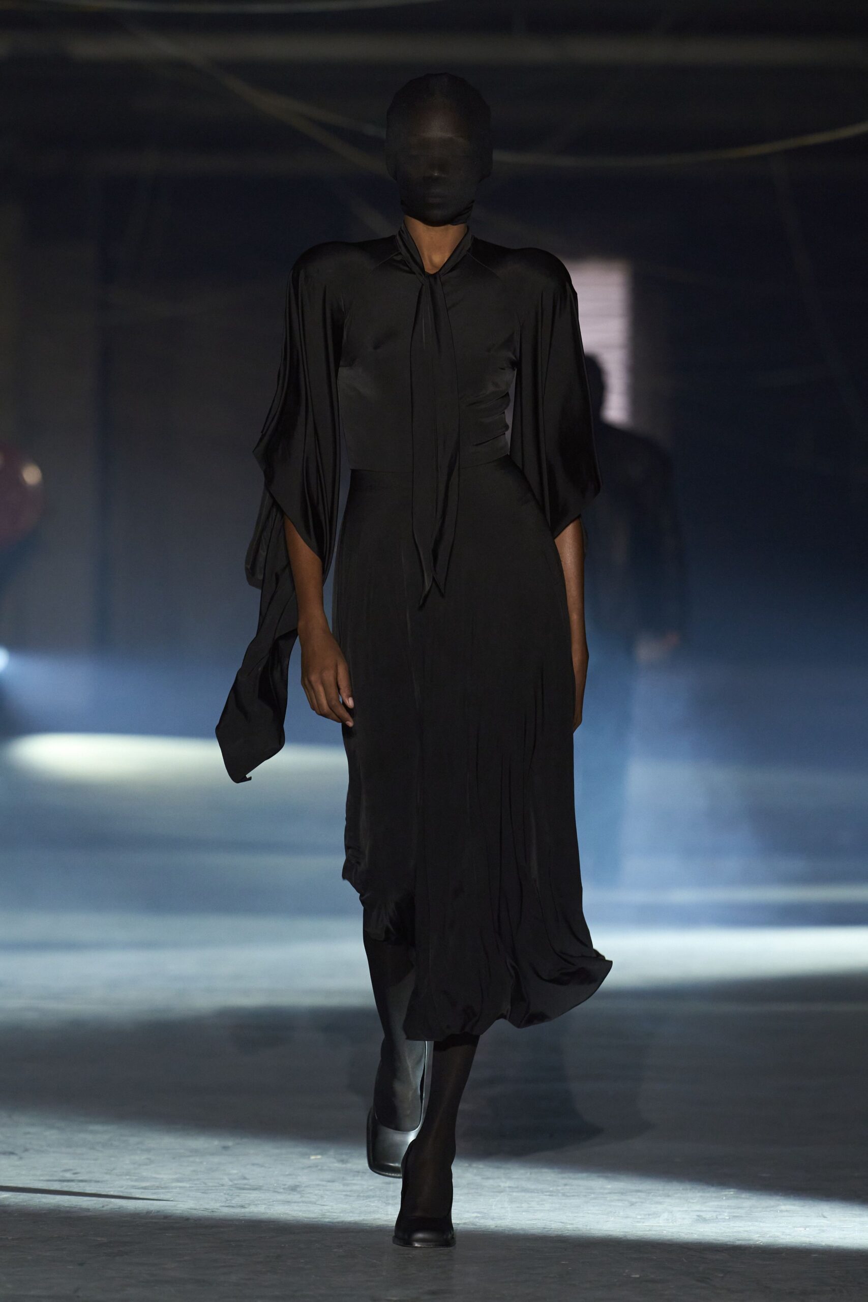 black silk midi dress with flowing sleeves