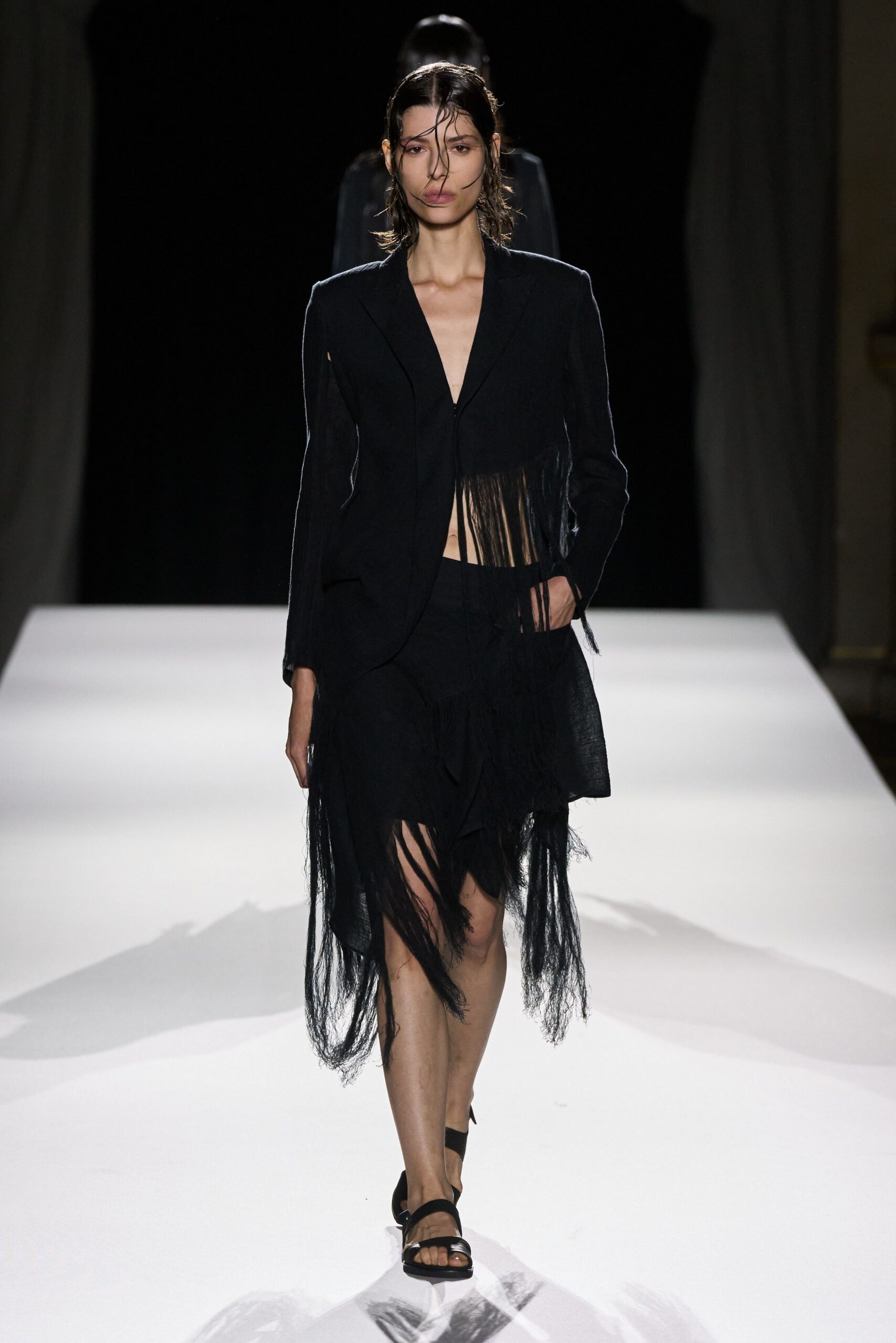 black fringed blazer and skirt
