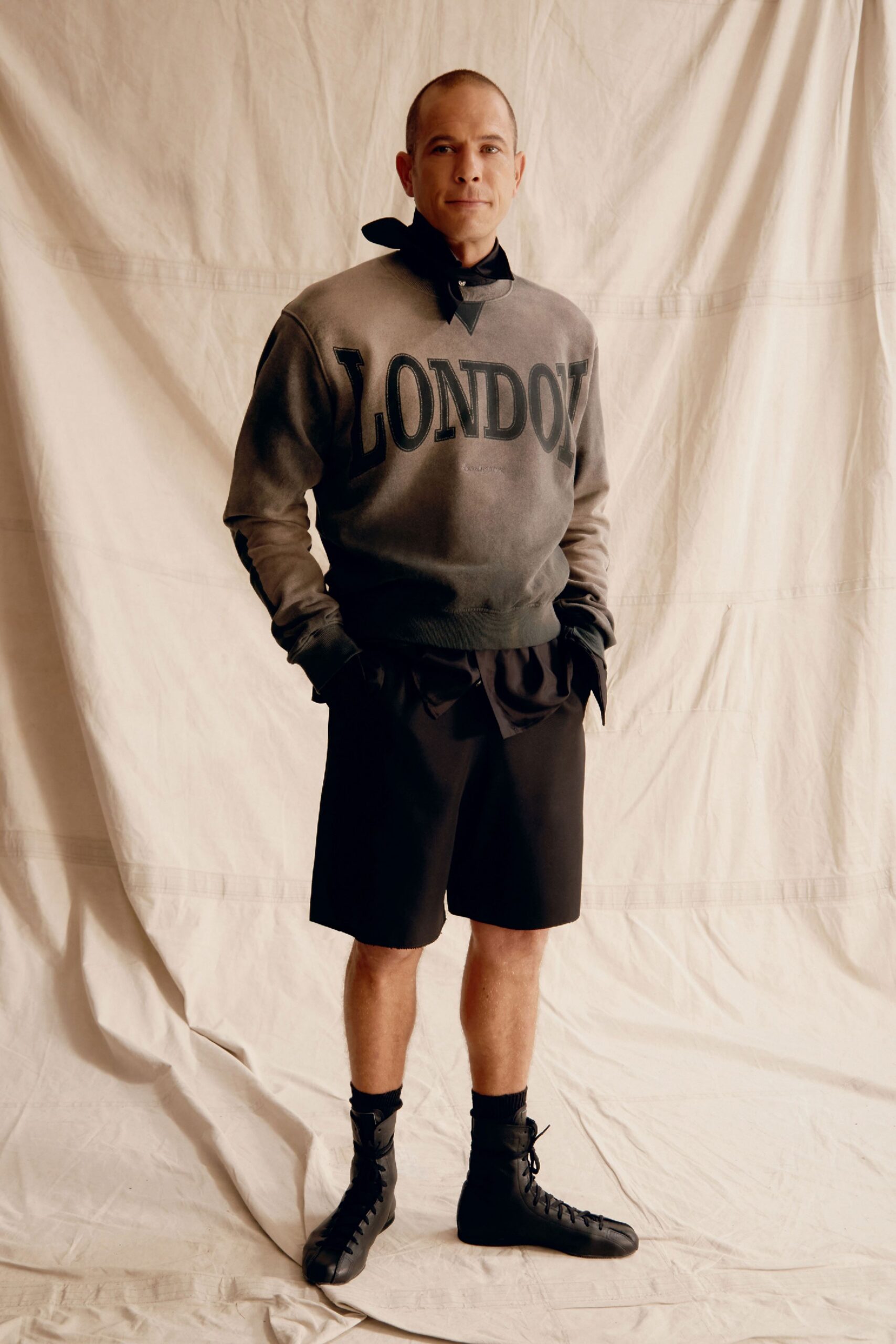 gray relaxed sweater black shorts