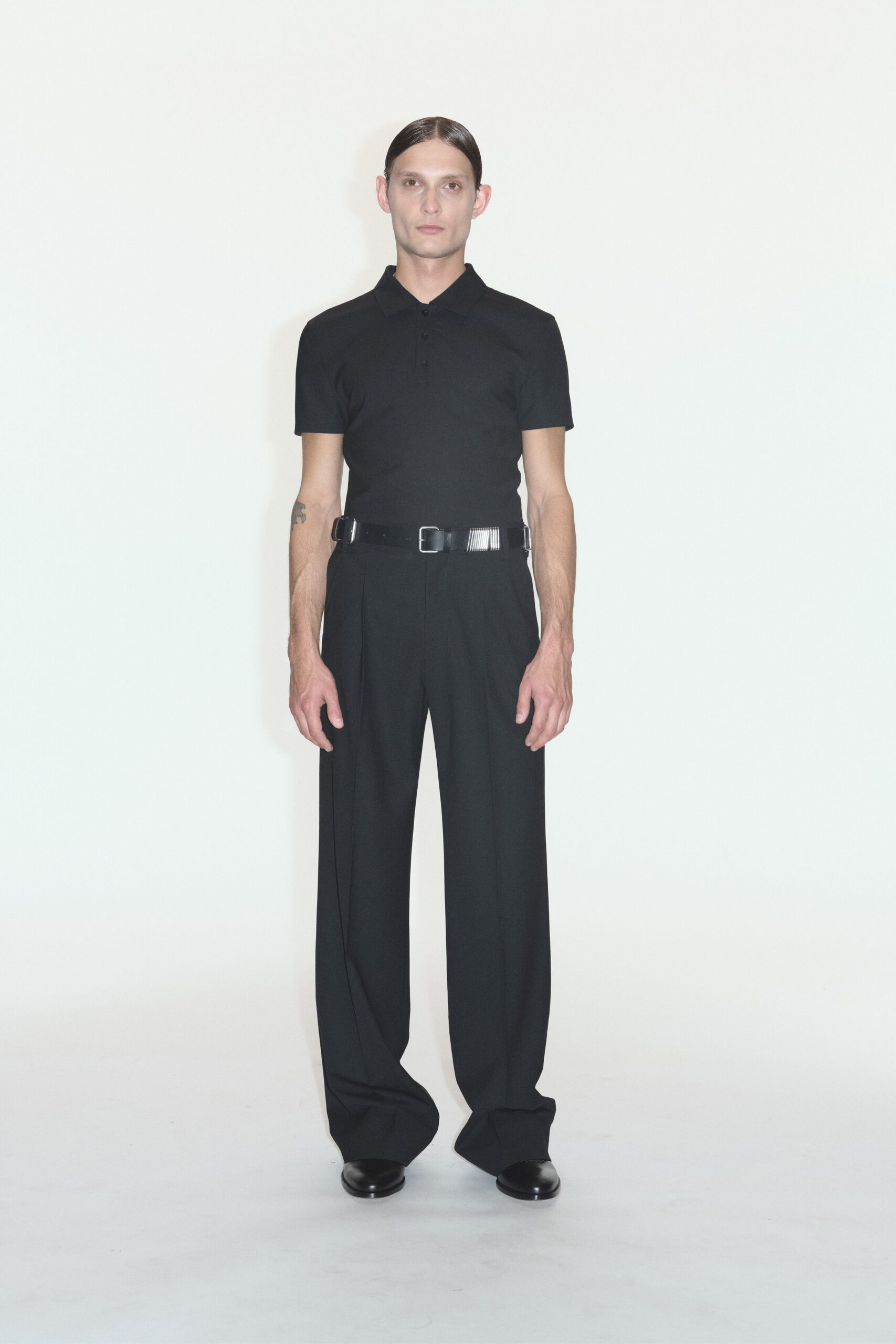 black fitted shirt and relaxed pants