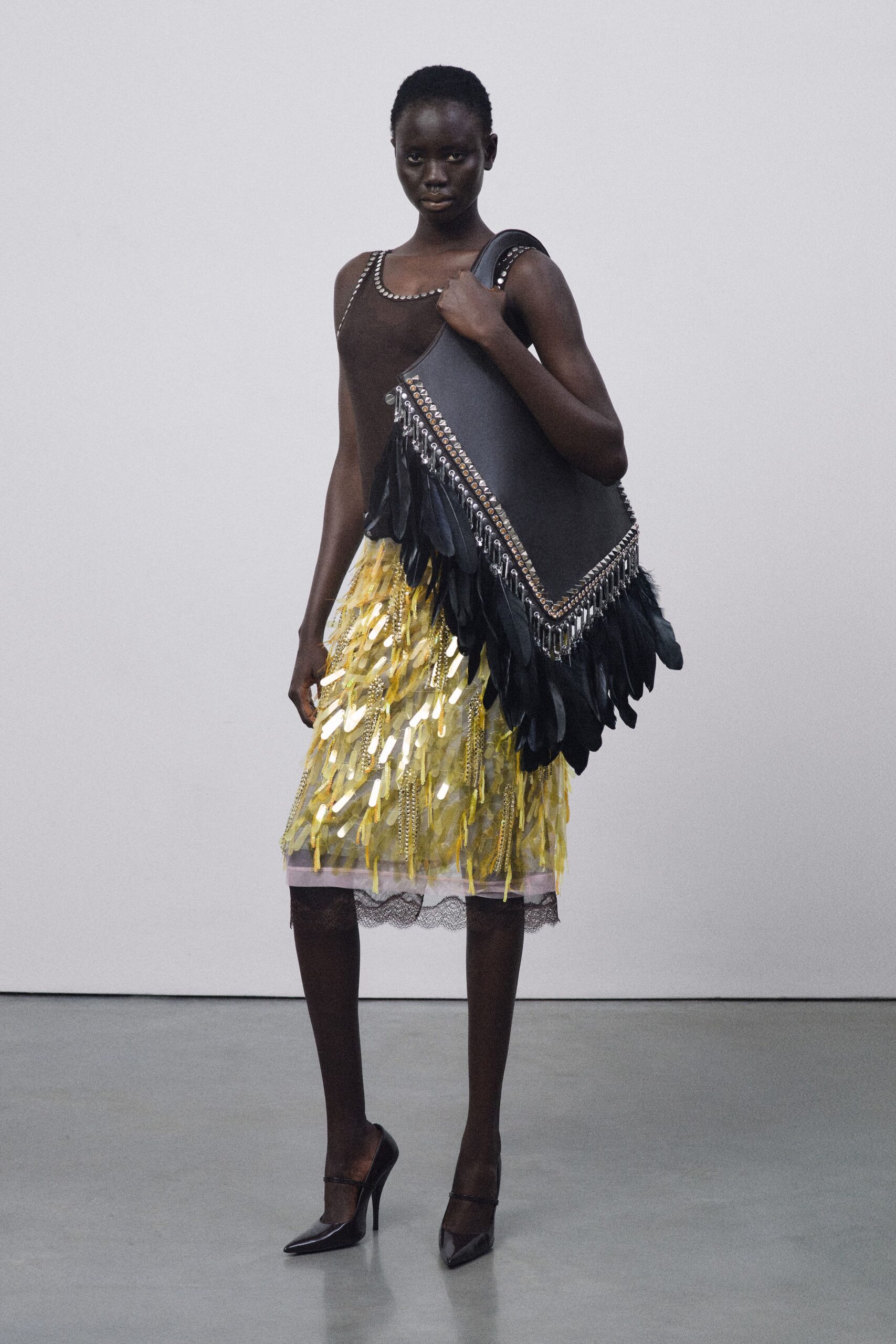 black silk top yellow fringed skirt