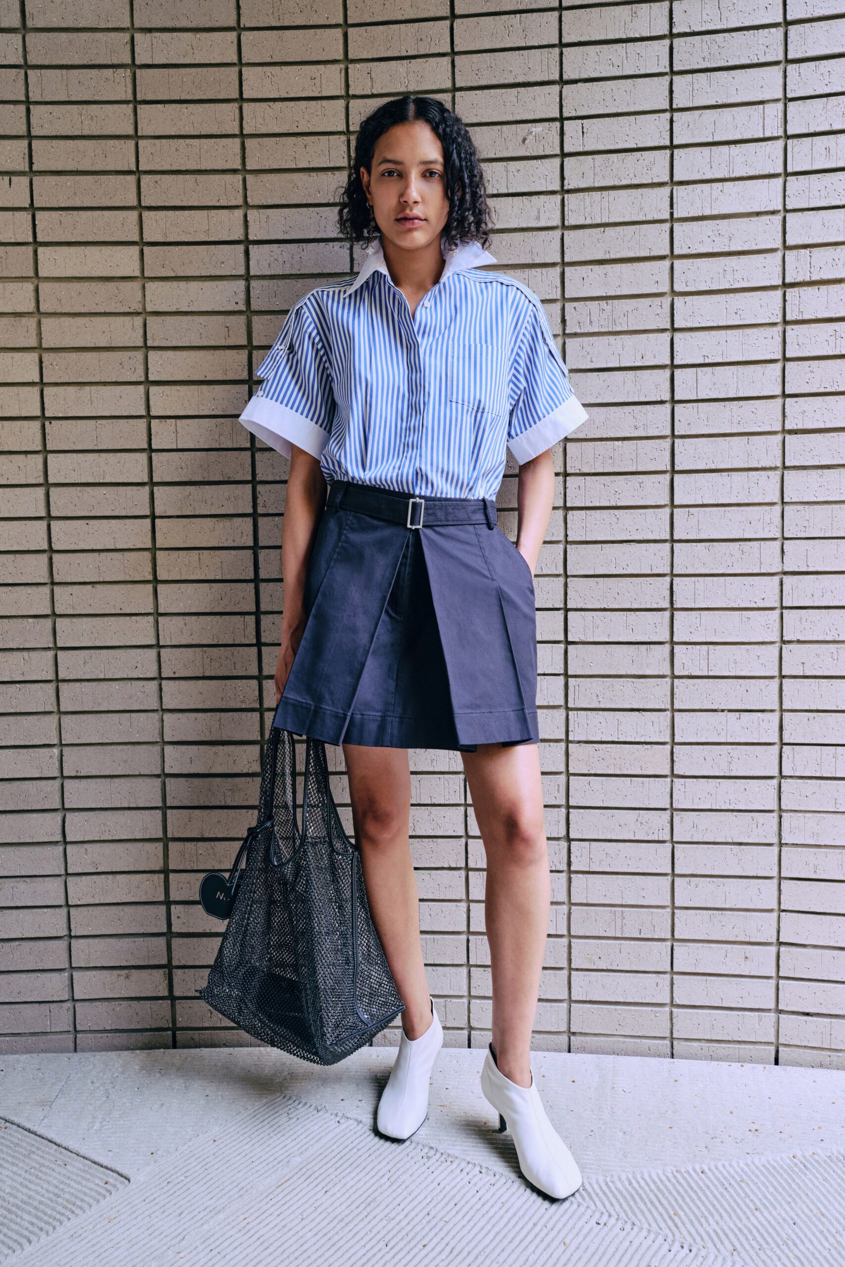 striped shirt black pleated skirt