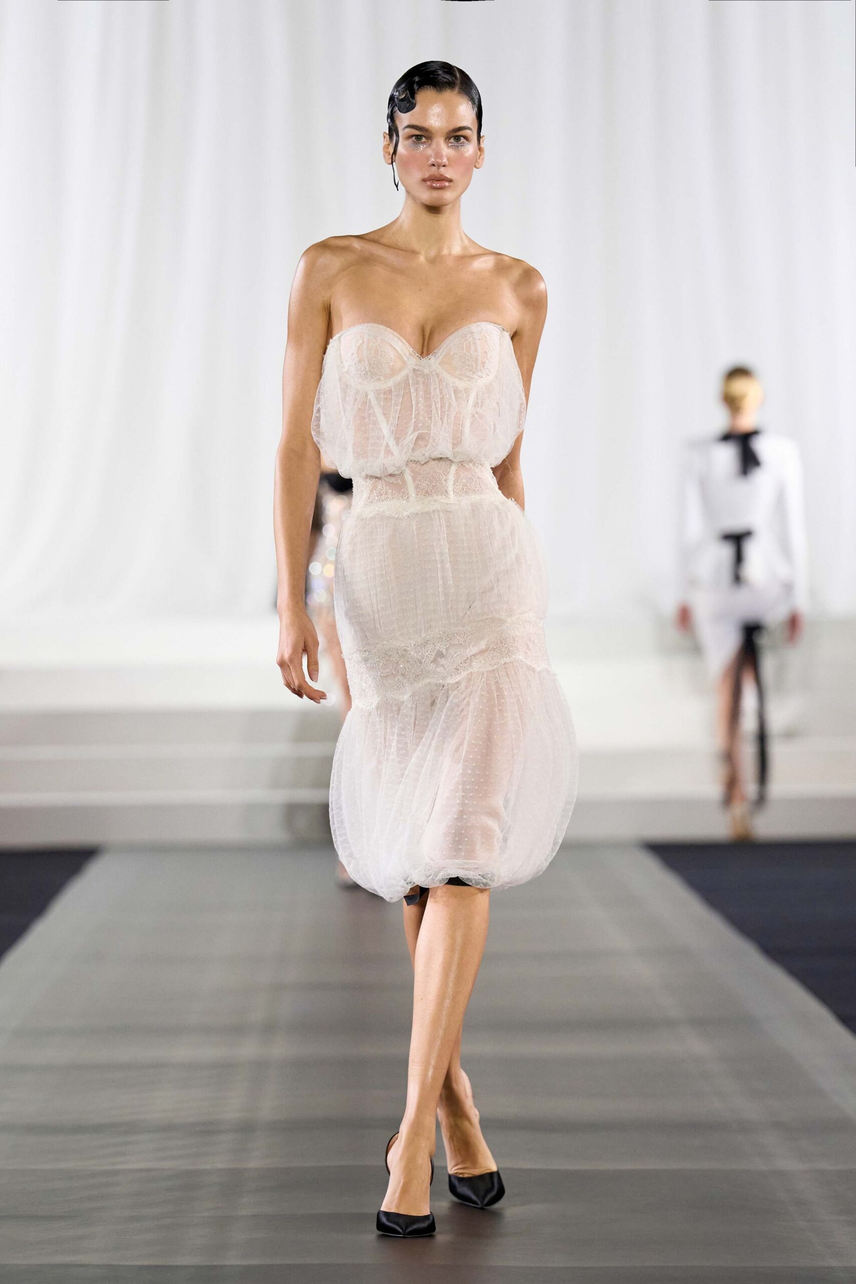 white strapless ruched midi dress with black heels