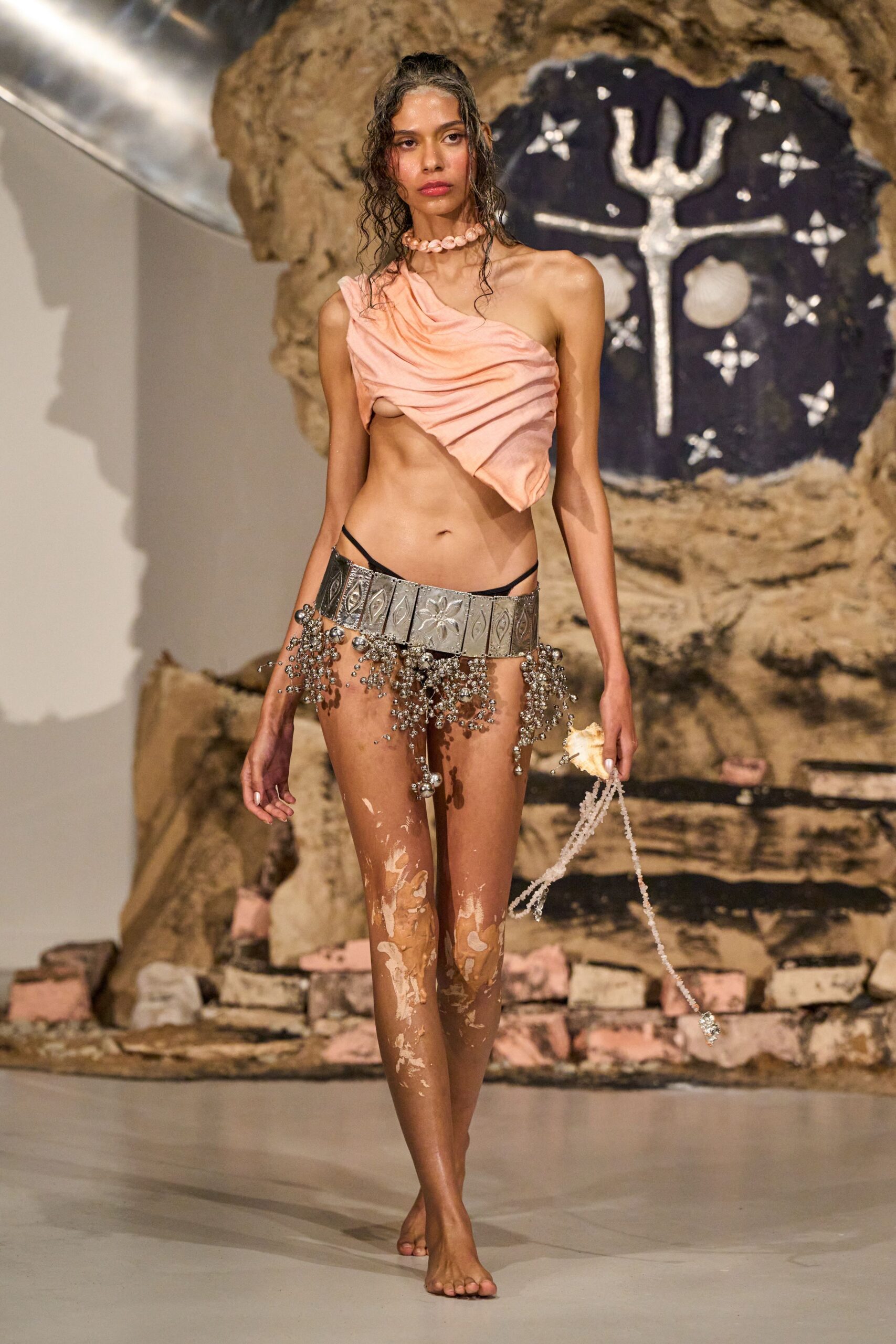 pink draped top with silver skirt