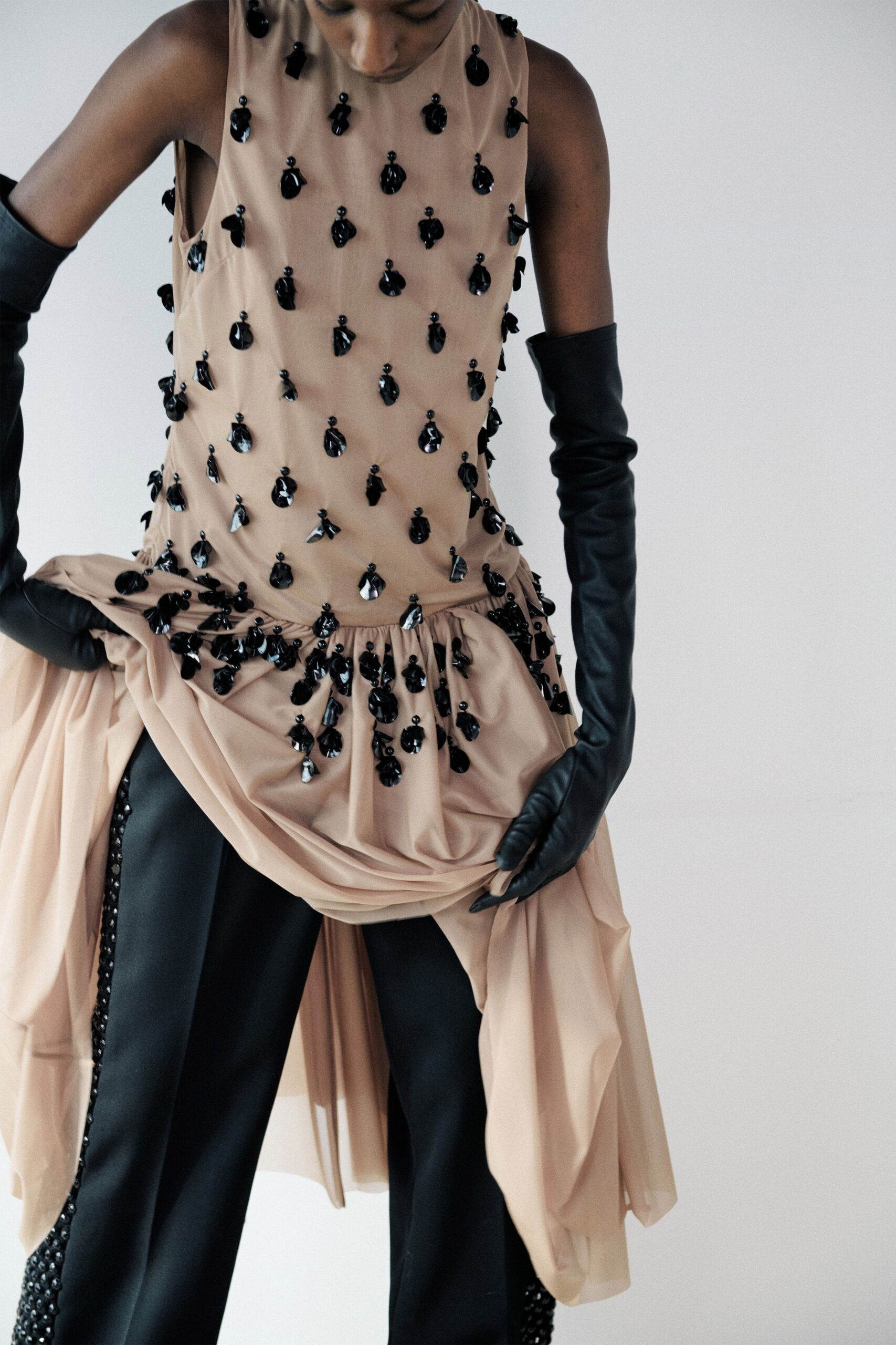 beige silk sleeveless high-neck fitted embroidered draped top