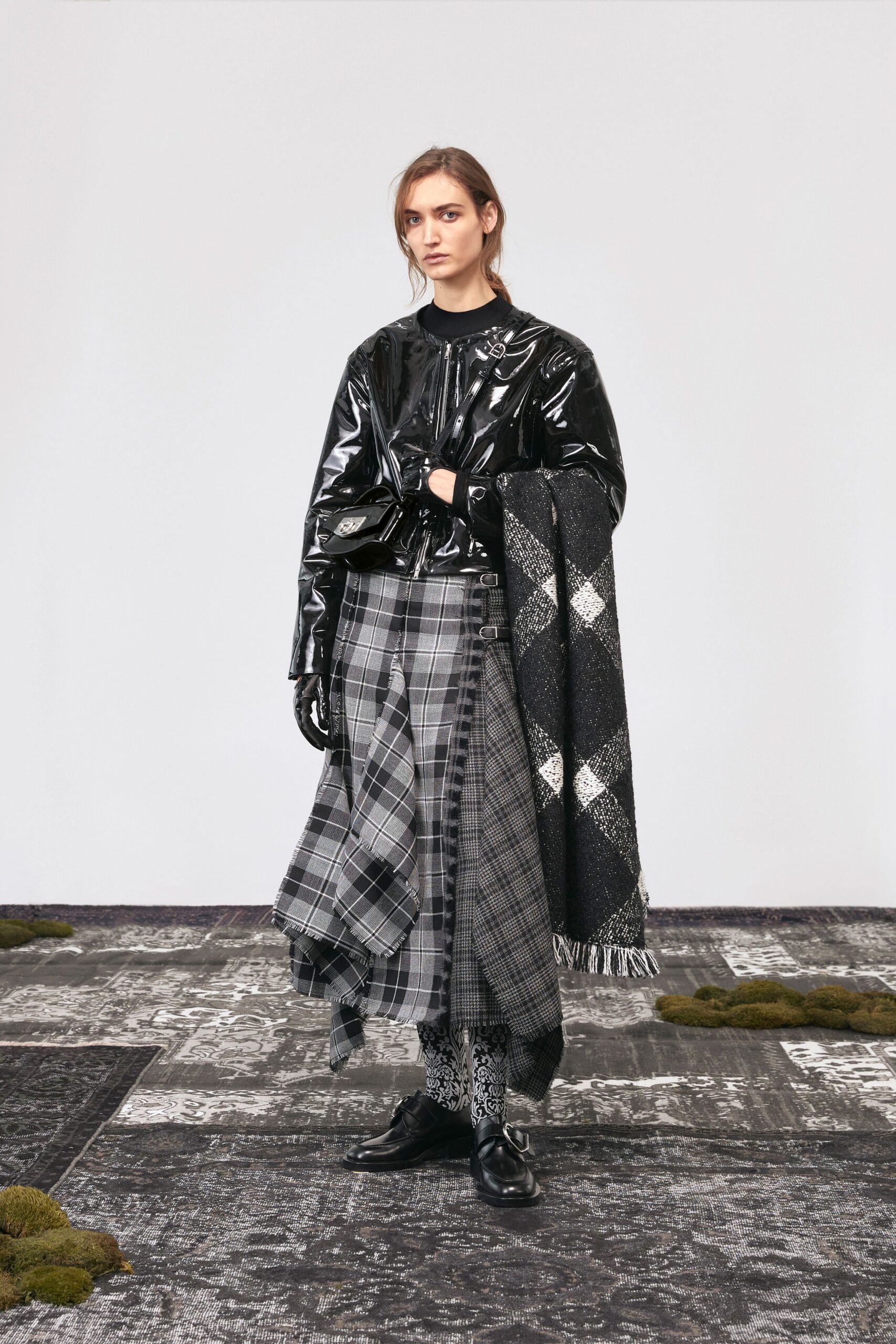 black vinyl coat with pleated skirt