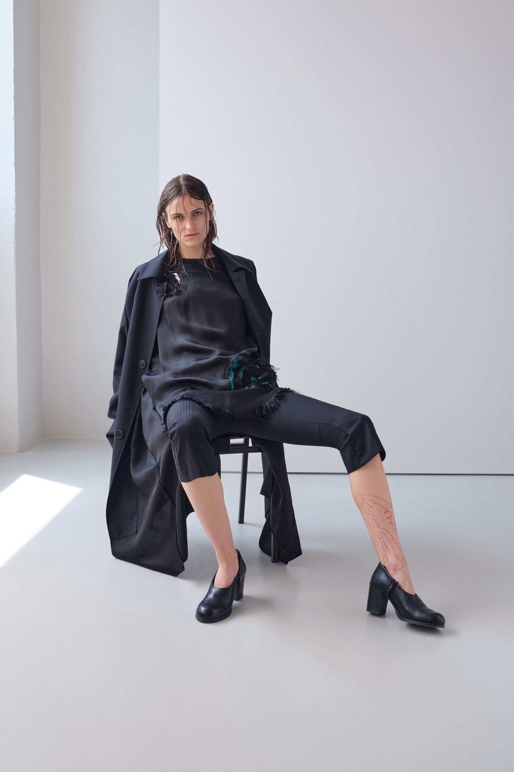 black wool coat with silk top