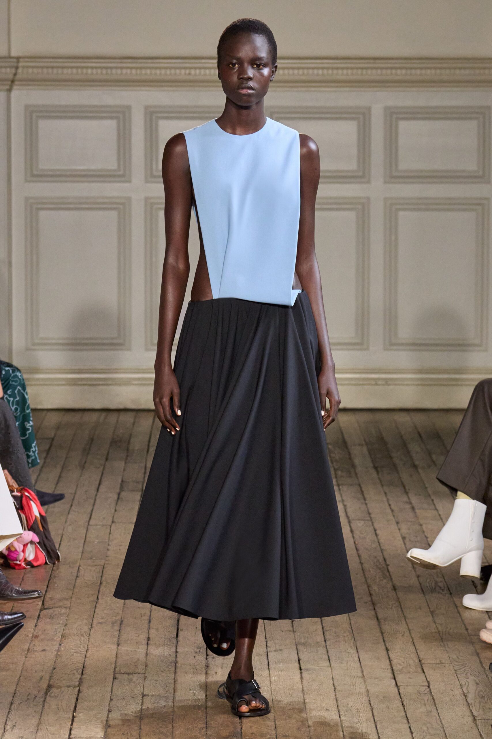 blue fitted top black pleated skirt