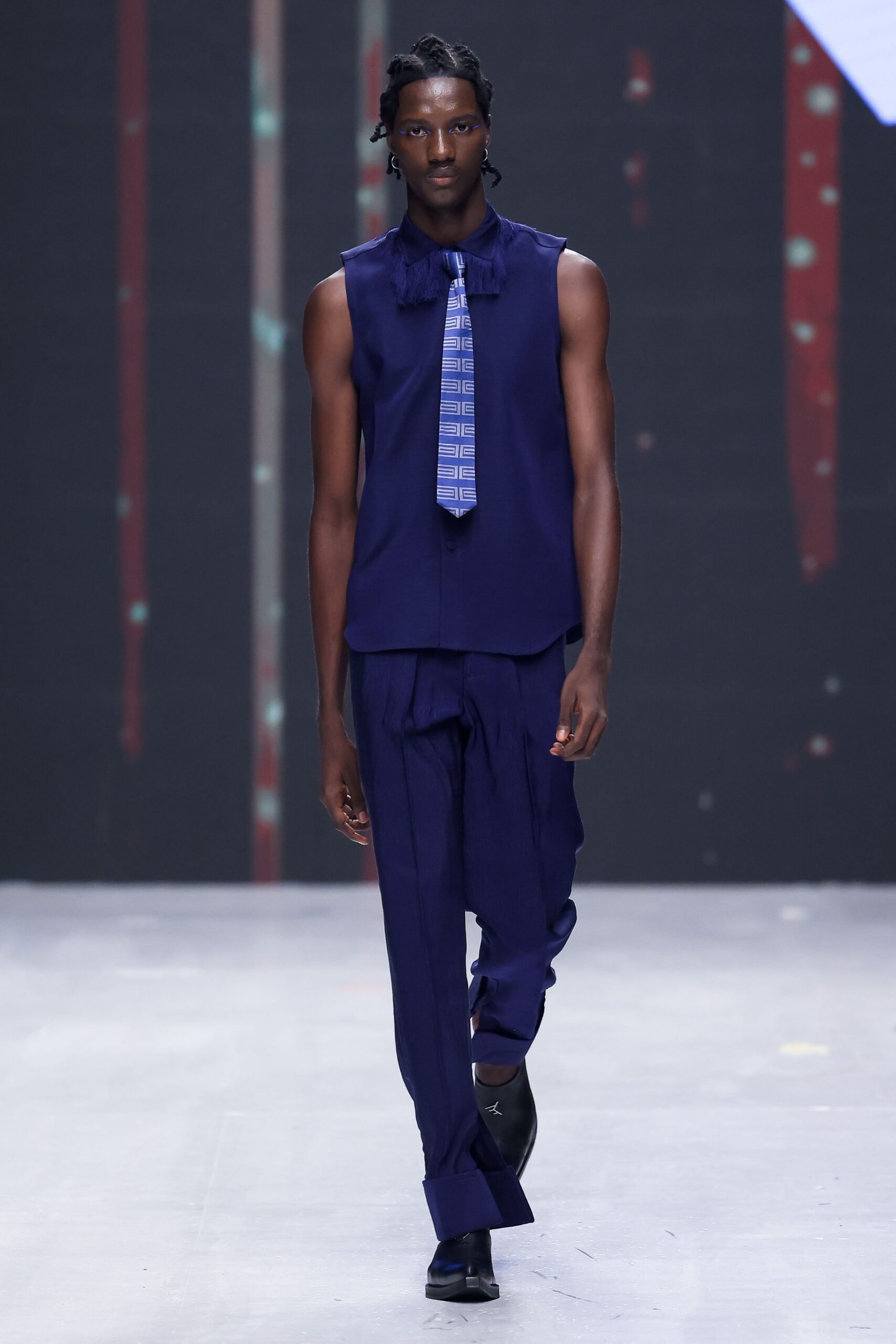 blue sleeveless top with tie