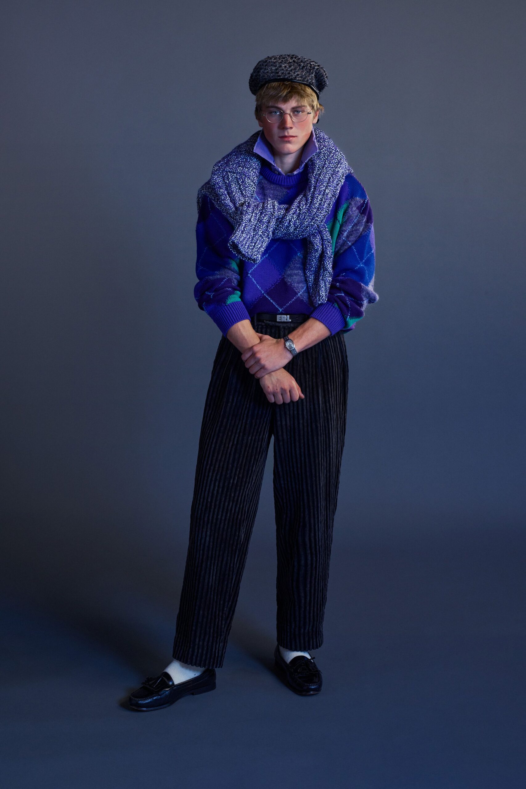 blue argyle sweater with striped pants