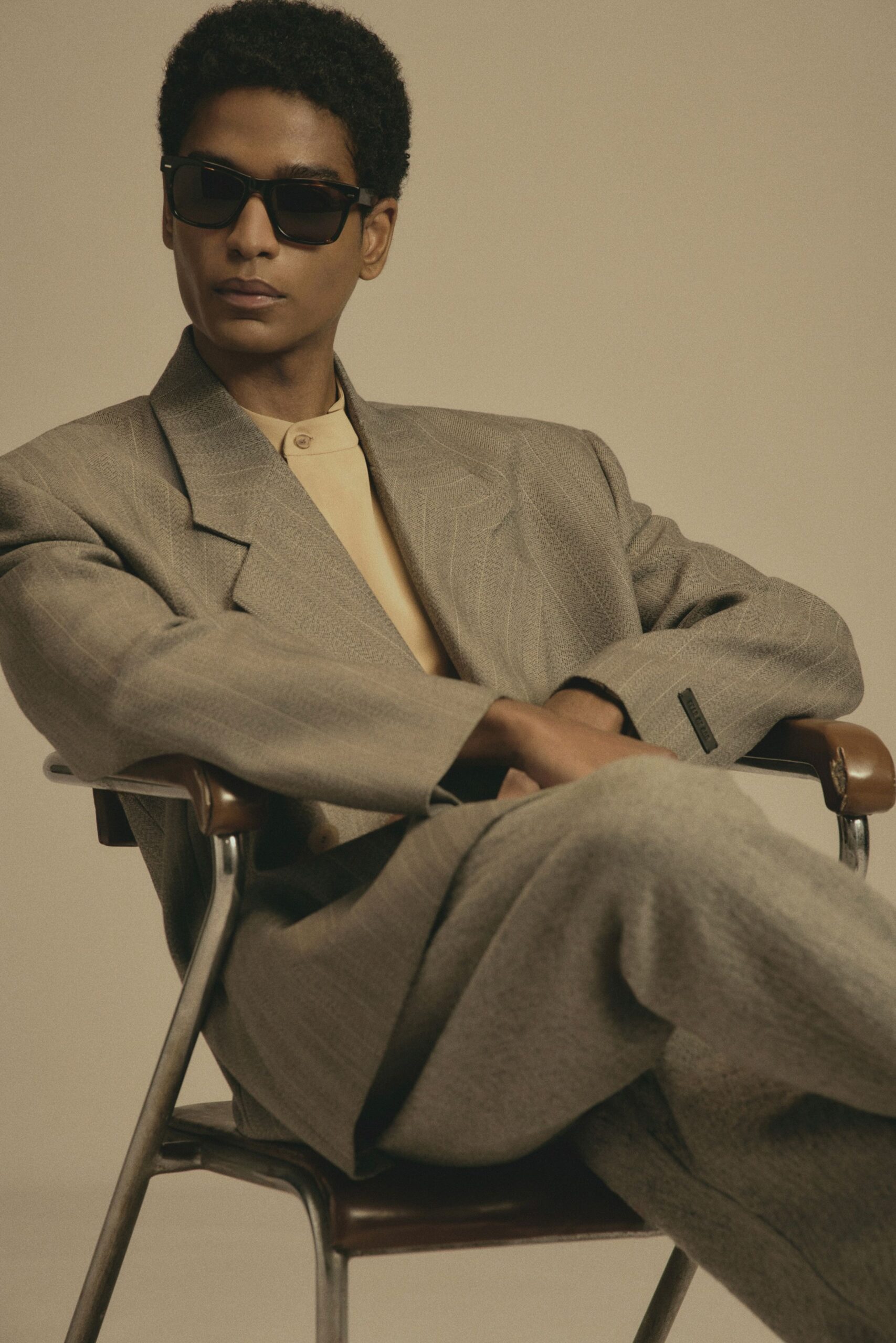 gray tailored suit with sunglasses