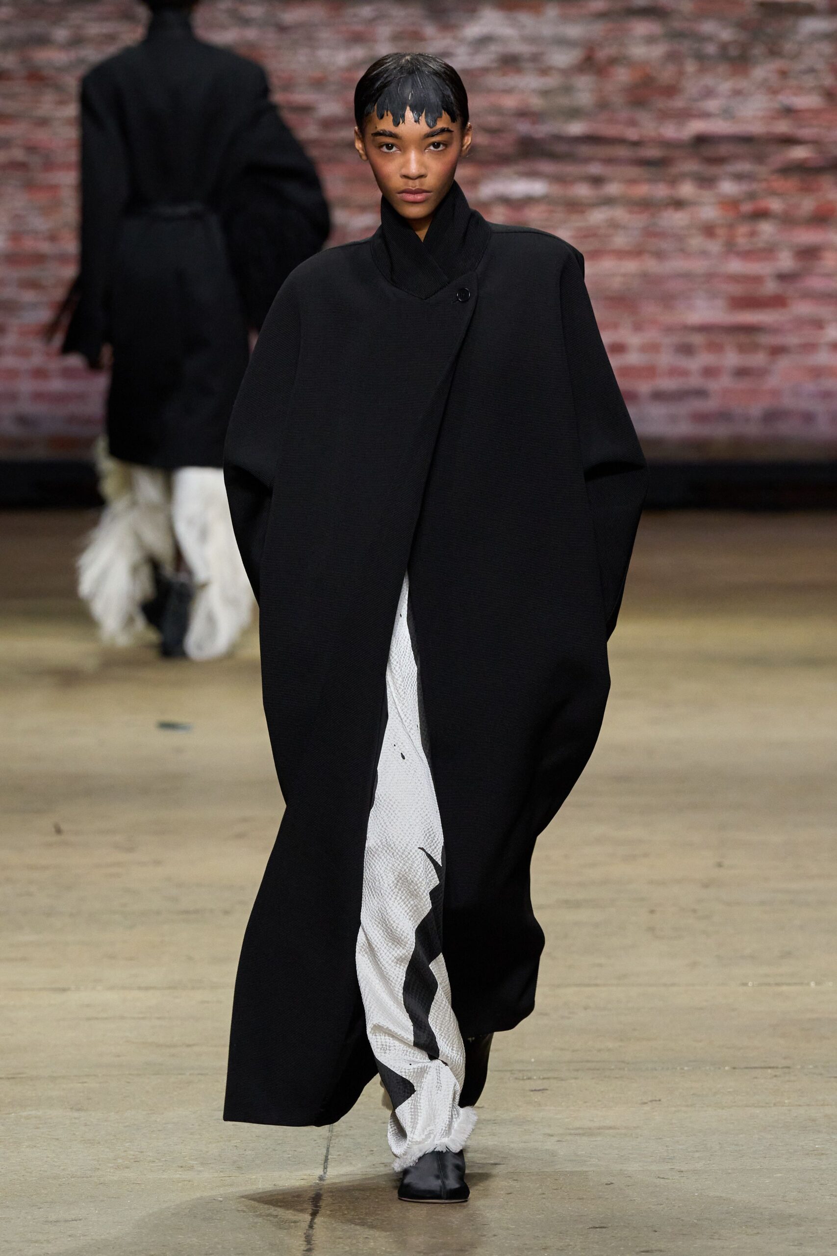 black wool long-sleeve collared oversized draped coat