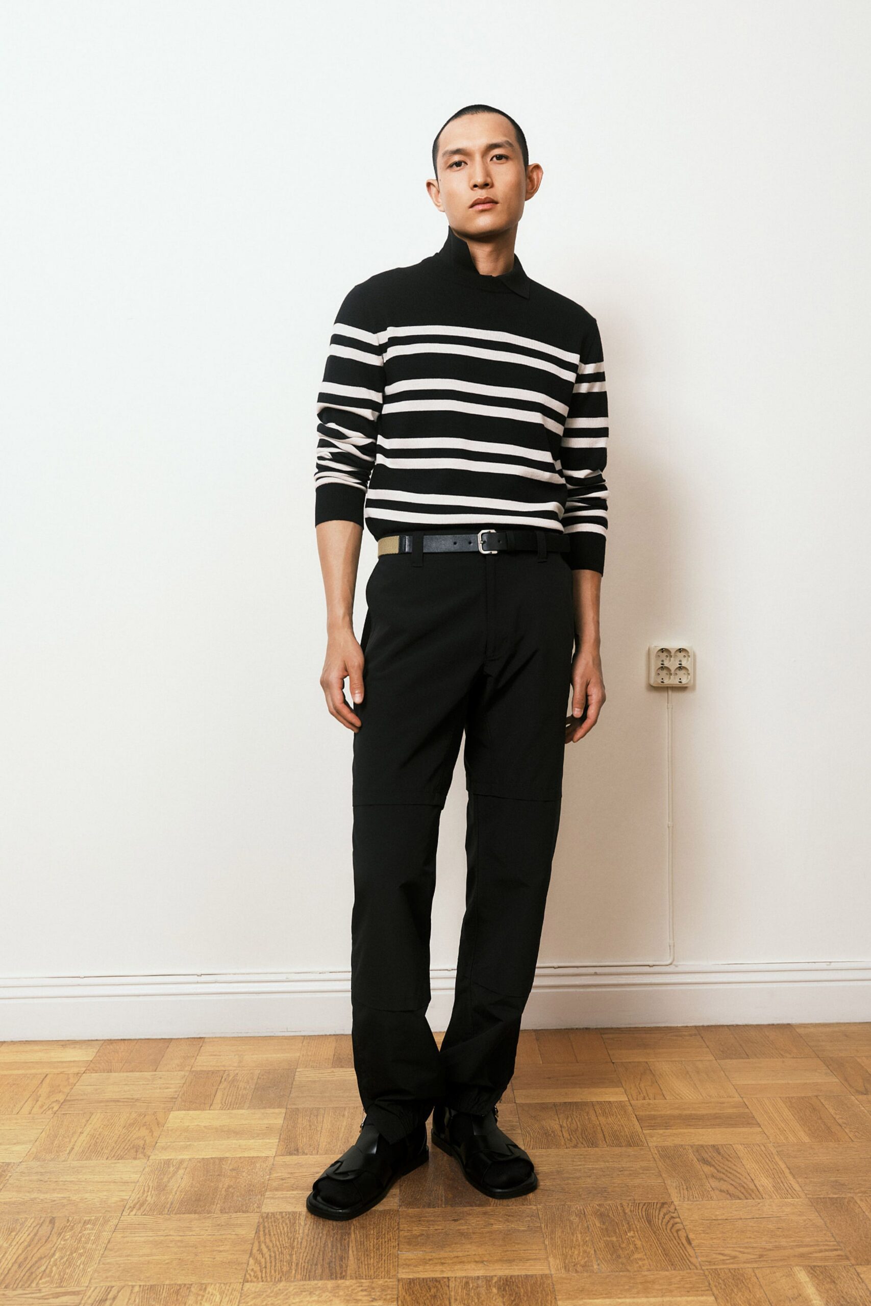 black and white striped sweater with tailored pants